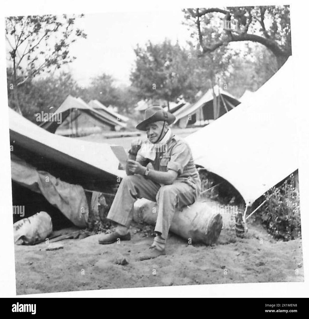MEN IN GROUP 1 PREPARE TO GO HOME - RQMS R.G. Parker (Pioneer Corps) of