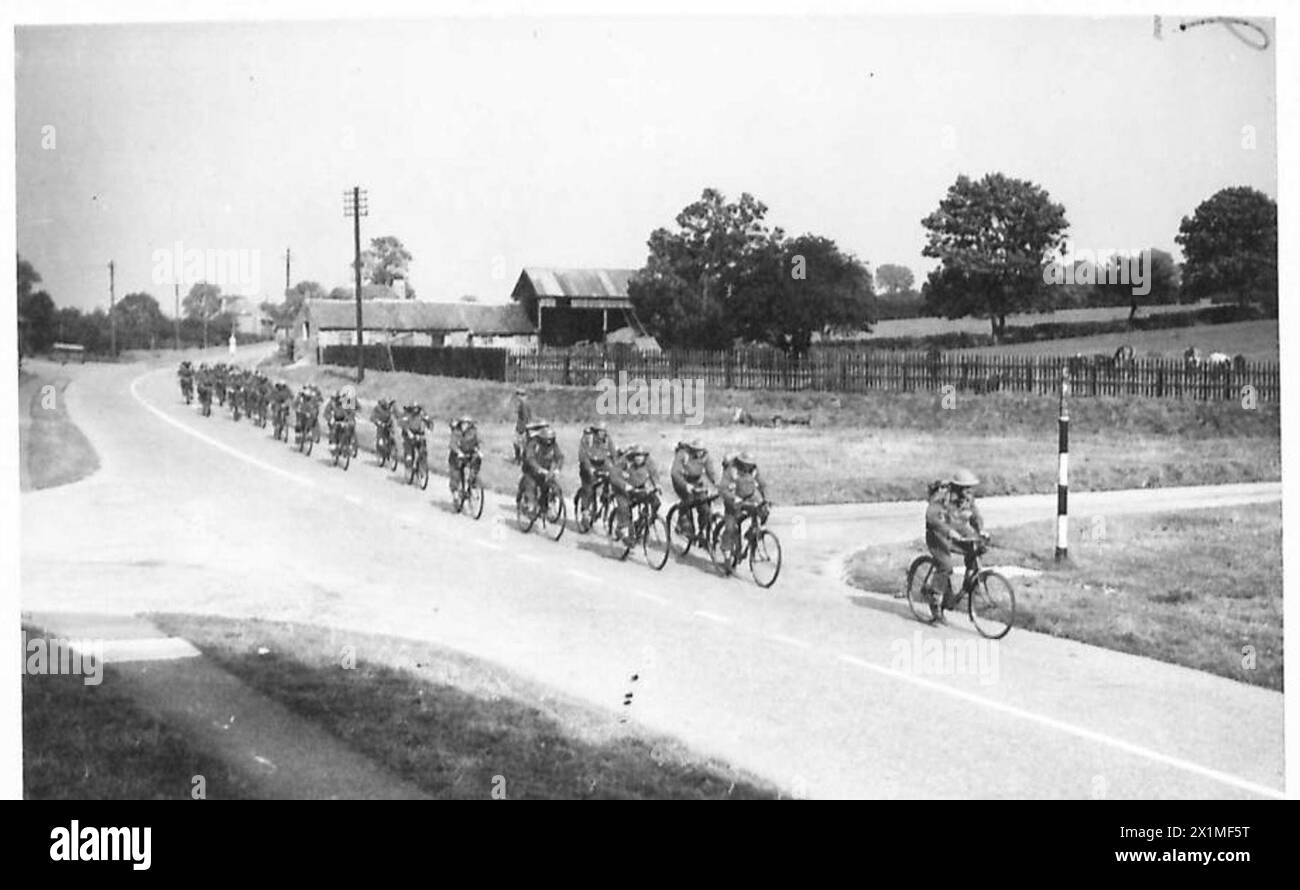 ROUNDING UP ENEMY PARACHUTISTS - A tank hunting platoon on bicycles on the way to the location to destroy enemy fighting vehicles, British Army, 5th Battalion, Border Regiment, British Army, 125th Infantry Brigade, British Army, 42nd Division Stock Photo