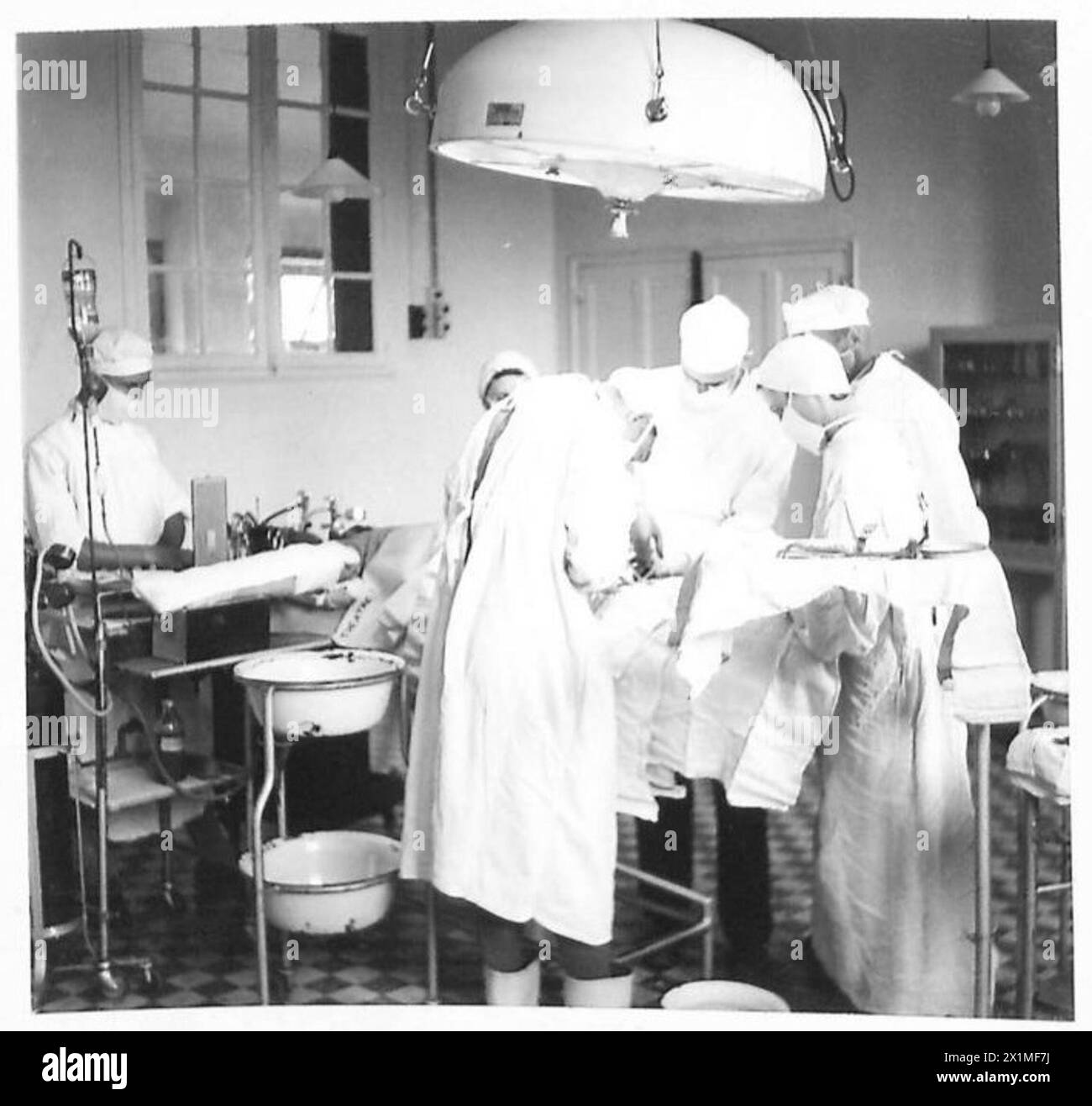 Major Moore Major Moore conducts surgery in a newly opened, well-equipped operating ...