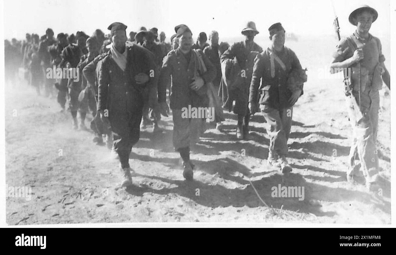 Italian prisoners are marched back by British Army troops during the ...