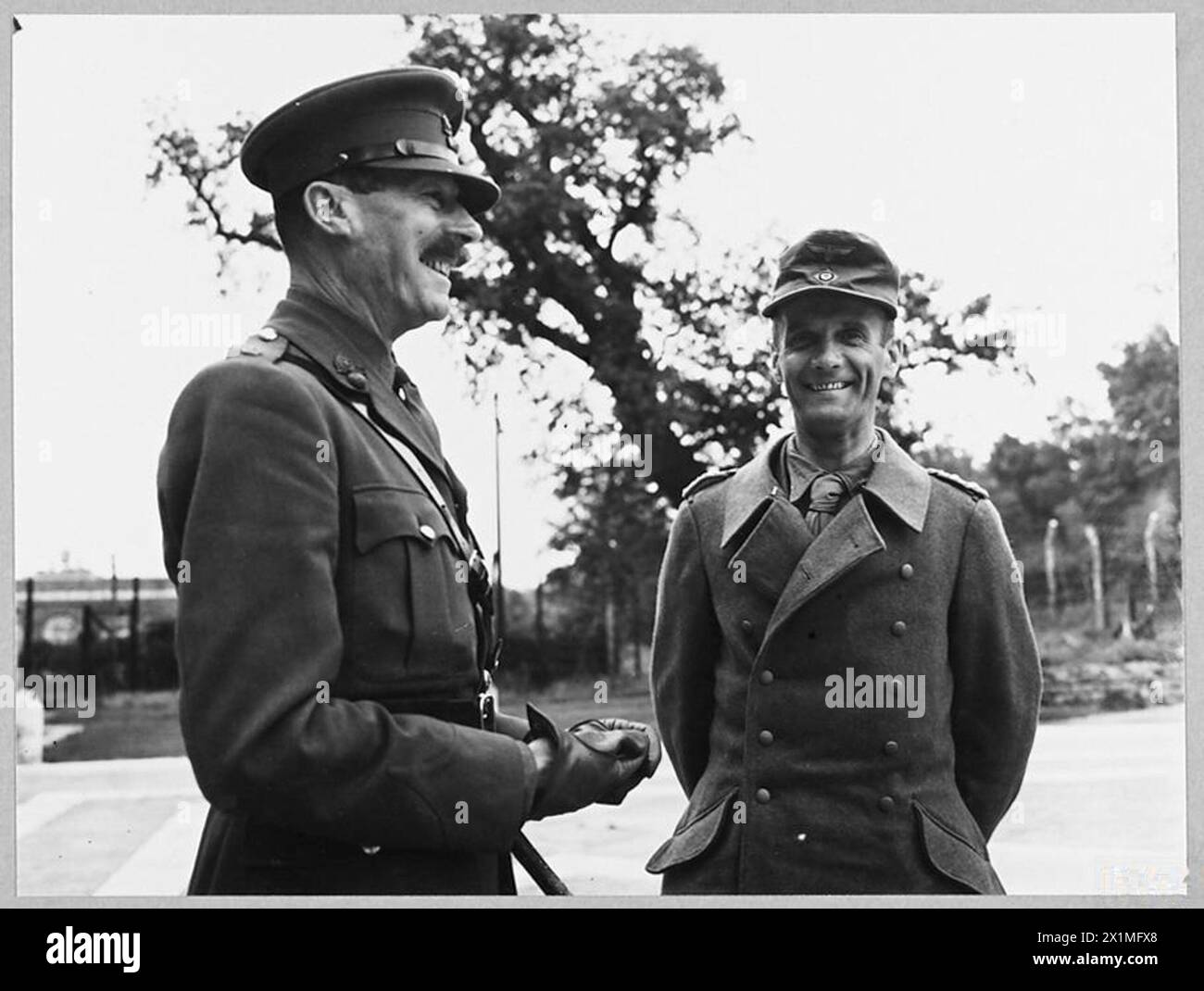 AXIS GENERALS ARRIVE IN SOUTH OF ENGLAND AS PRISONERS OF WAR. - 9958. Picture (issued 1943) shows - Colonel von Hulsen talking with the camp commandant before being conducted to join other senior German officers already in the camp, Royal Air Force Stock Photo