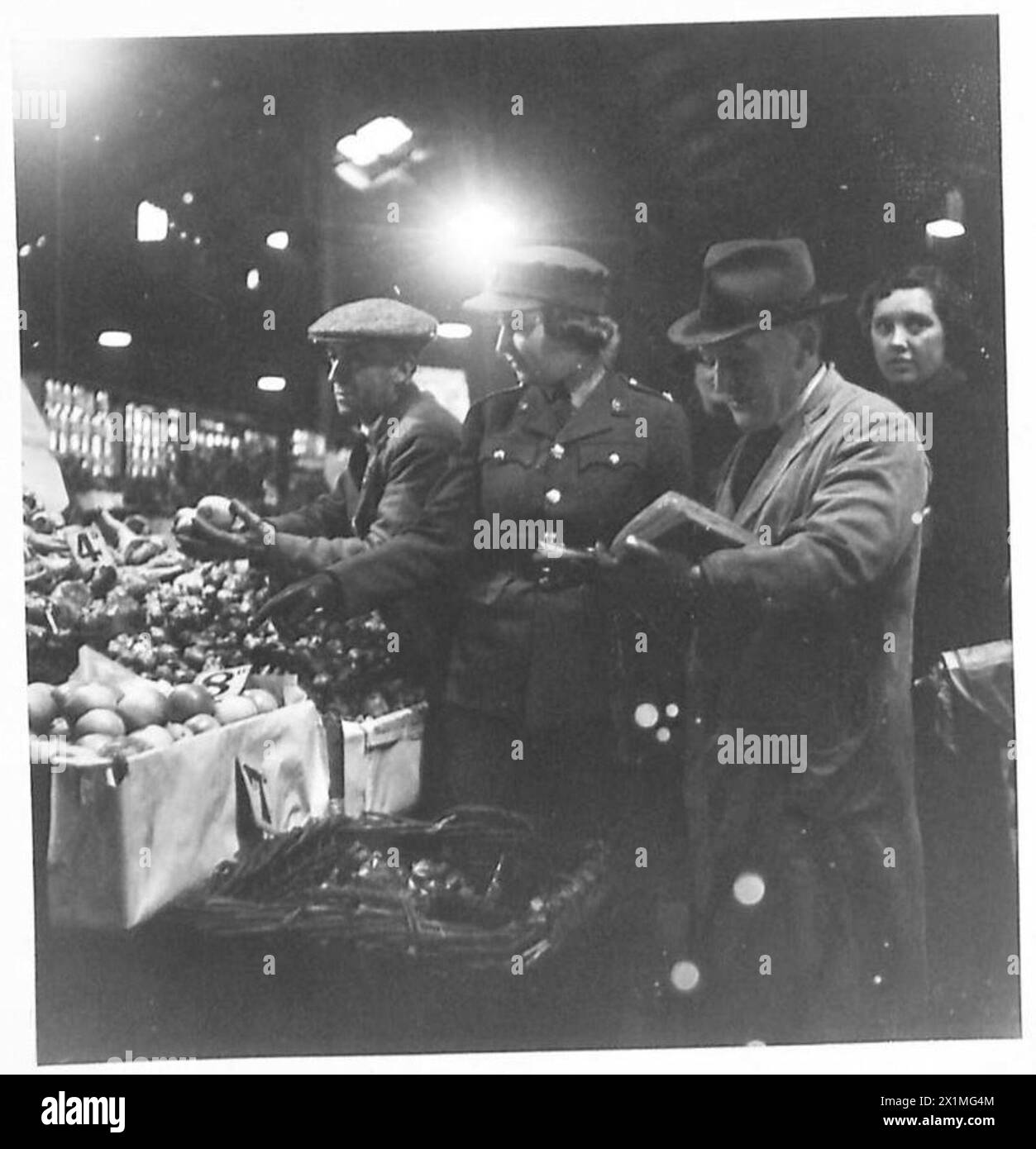 DAY IN THE LIFE OF AN ATS MESSING OFFICER - Shopping in the market. To ensure that vegetables and fruit are fresh, the Messing Officer is allowed to buy these on the day they are used. All other food is obtained from the NAAFI, British Army Stock Photo