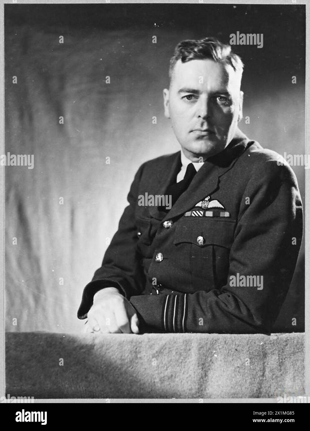 WING COMMANDER J.H. GILES, DSO., DFC. - Born in 1910 in Shanghai, Wing Commander JOHN HASSAL GILES was educated at Victoria High School, British Columbia, and was commissioned in the R.A.F. in 1936. He was awarded the D.F.C in August 1943, and won the D.S.O. in March 1945. On one occasion when attacking a target at Essen, Wing commander Giles's aircraft was coned in searchlights for nine minutes and damaged by anti-aircraft fire. 'He has at all times displayed a high degree of courage and determination, and has set a fine example to the younger captains' stated a ciation. Picture issued 1945, Stock Photo