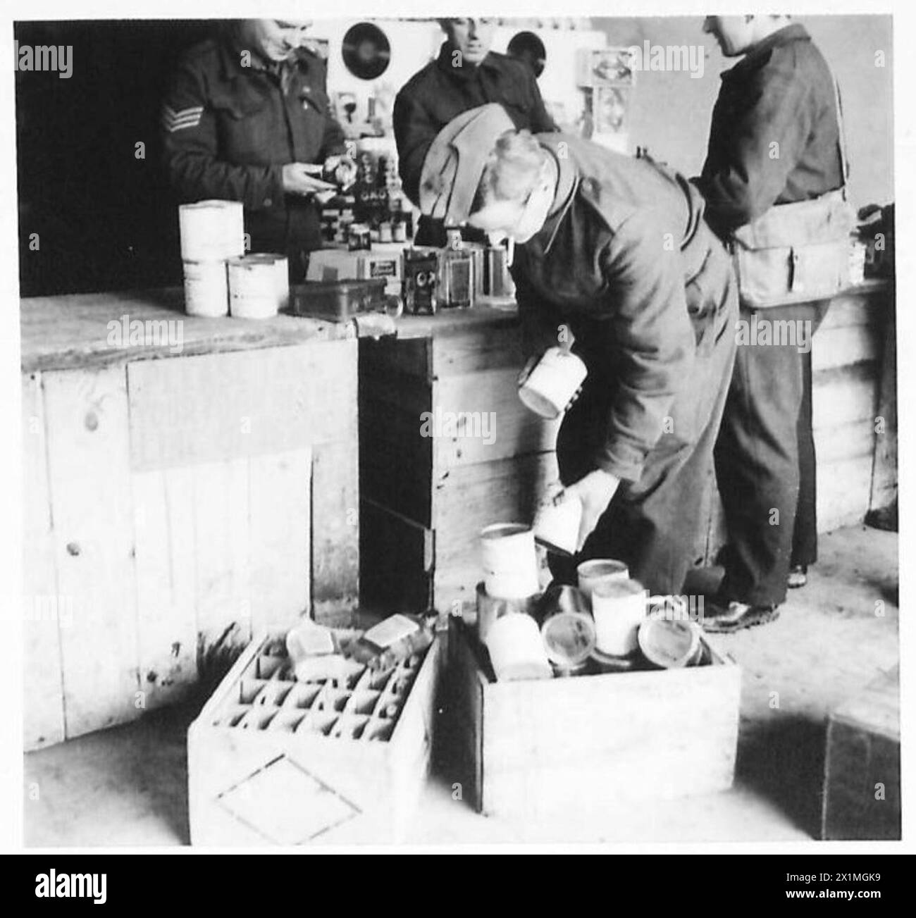 Soldier Ration Box A soldier of the Eighth Army fills a box with his unit's issued ...