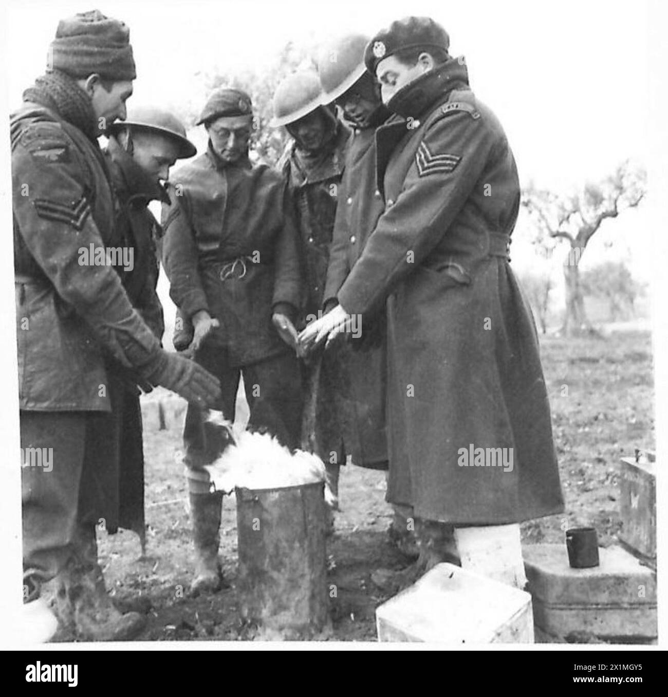 Men of the RAF Regiment serve at the forward positions of the British Eighth Army in Italy, maintaining operations and enduring cold weather near the front lines. Stock Photo