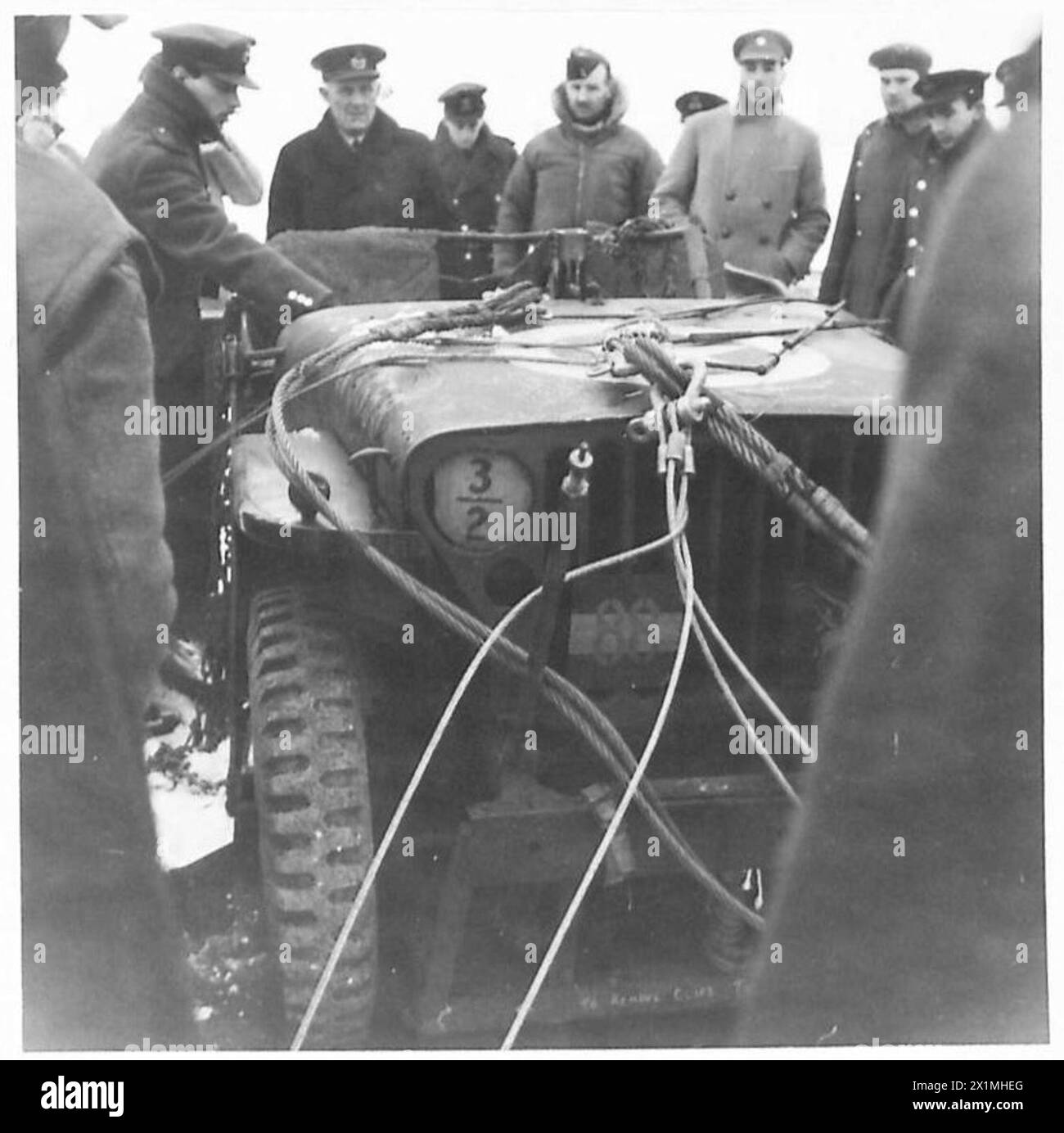 DEMONSTRATION 'AIRBORNE' SALISBURY - Officers examine a jeep after it had been dropped by parachute, British Army Stock Photo