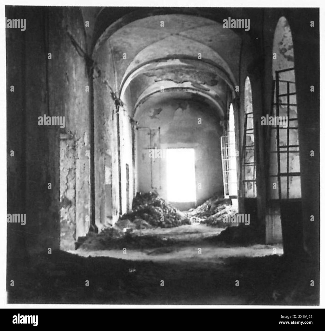 ITALY : FIFTH ARMYDAMAGED CULTURAL BUILDINGS IN NAPLES - Interior view of the library; the rubble on the floor is the remains of some of the books, British Army Stock Photo