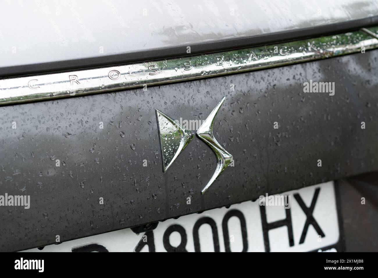 Kyiv, Ukraine - April, 2024. Ds 7 Crossback exterior car close-up logo with water drops. Stock Photo