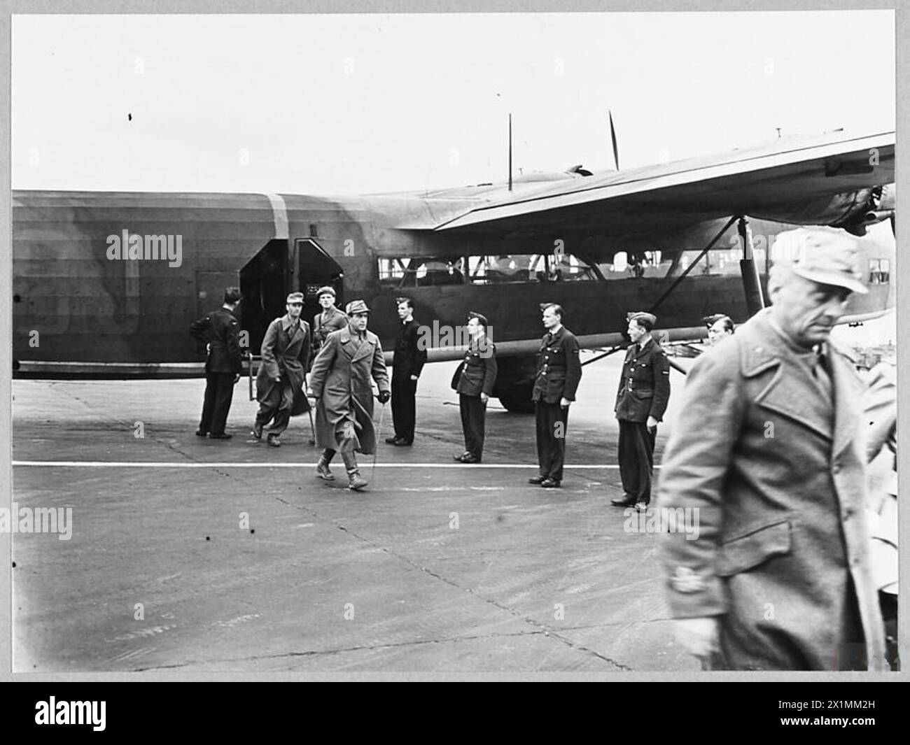AXIS GENERALS ARRIVE IN SOUTH OF ENGLAND AS PRISONERS OF WAR. - 9958. Picture (issued 1943) shows - Brigadier General Mancinelli [Italian Army] in foreground and Colonel von Hulsen who commanded German 21st Armoured Division, leaving Harrow aircraft on arrival at an airfield in Southern England, Royal Air Force Stock Photo
