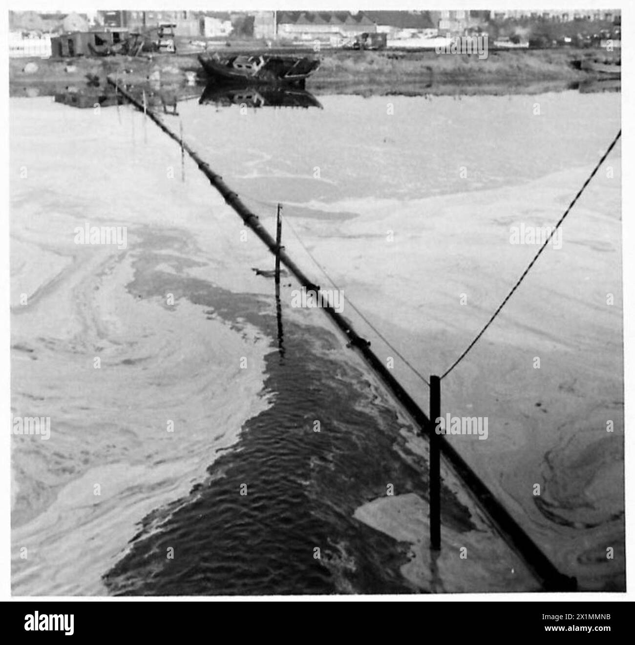 CLEARING OF MINES BY HIGH PRESSURE WATER JET - Showing the supply line from the low pressure pump, British Army Stock Photo