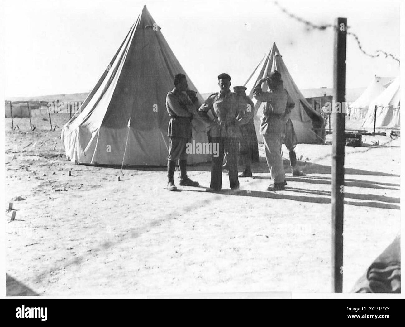 Italian officers are held as prisoners of war within a barbed wire ...