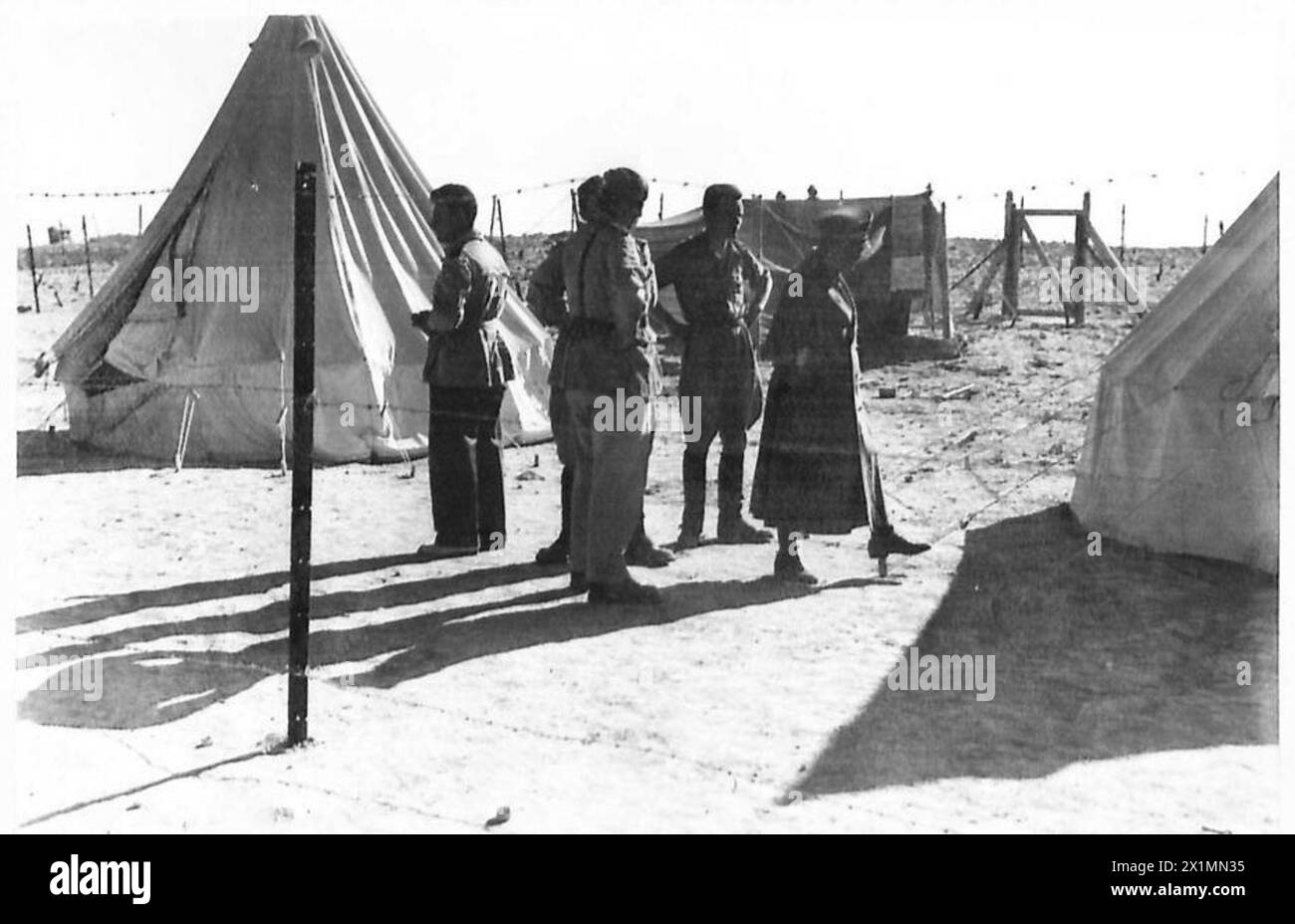 Italian officers who are prisoners of war are held within a barbed wire ...