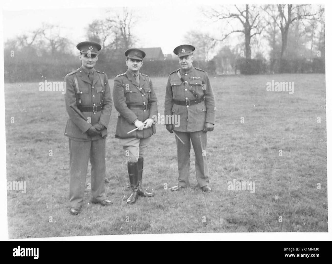 A MILITARY POLICE UNIT - Left to right - Lieut. J.P.R. Hoole; Captain R.D. Hammond and RSM H.F. Andrews, MM, British Army Stock Photo