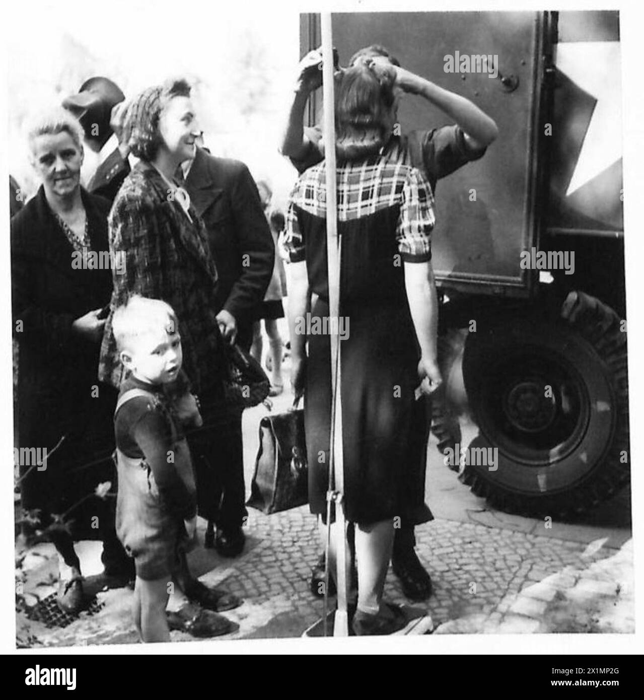 WEIGHING TIME IN BERLIN - A young German woman is measured for height ...