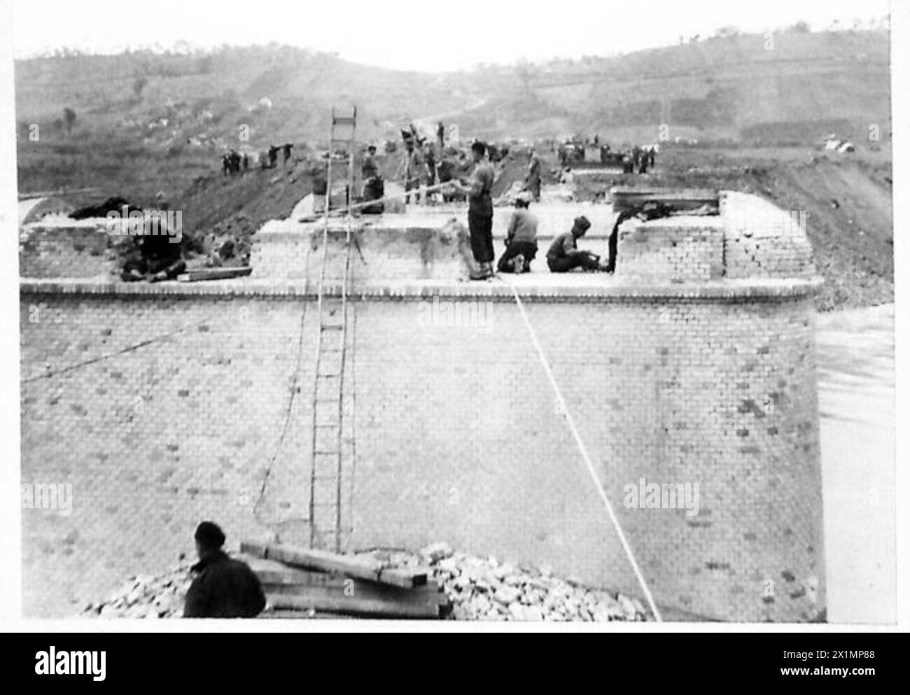Men of the 586 and 587 Field Companies, Royal Engineers, are leveling a ...
