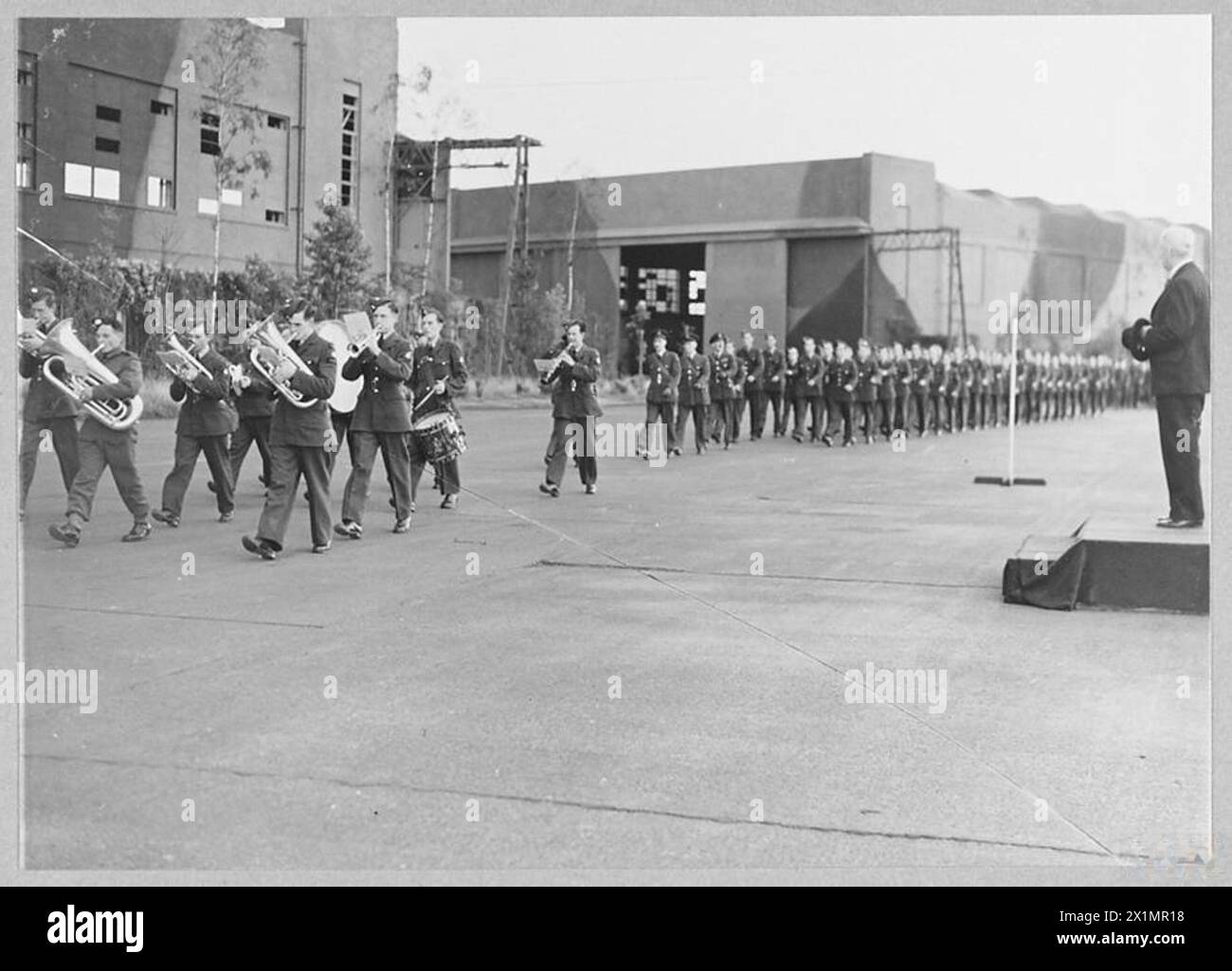 Sir Alan Burns observes an RAF bomber squadron march past during World ...
