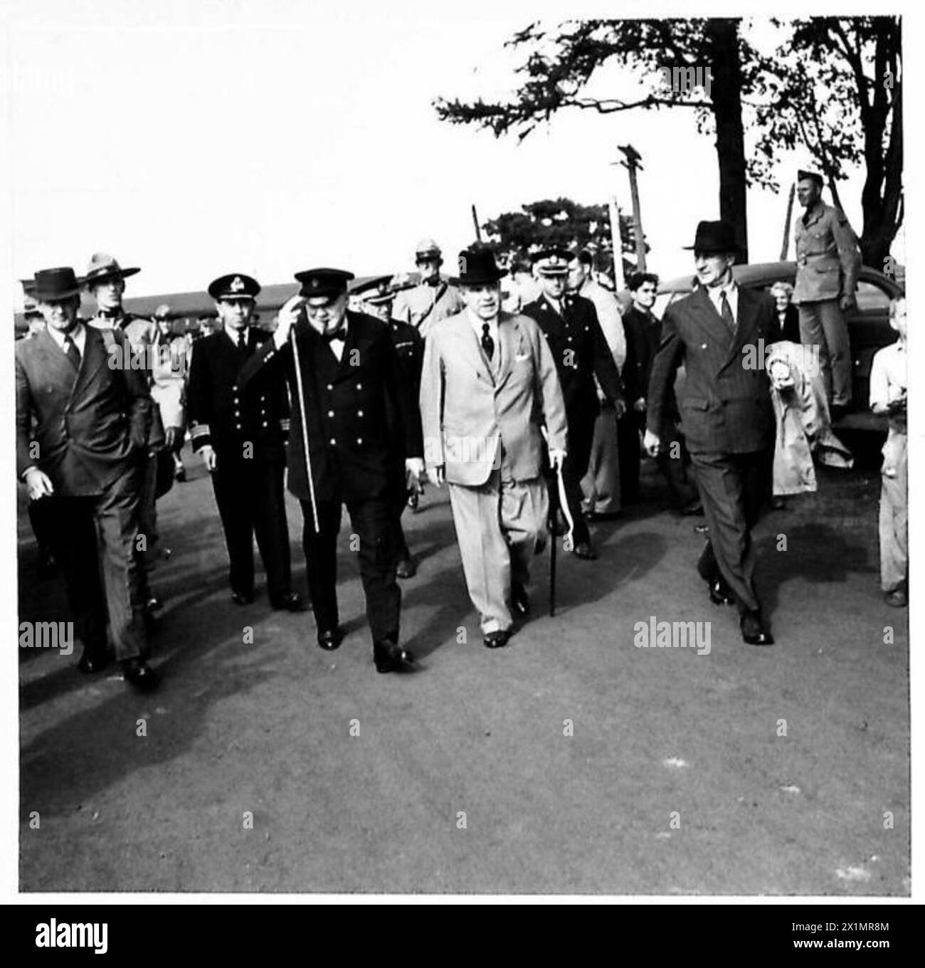MR. CHURCHILL IN CANADA - Mr. Churchill and Mr. MacKenzie King walking through the enthusiastic crowd of people which had assembled to watch his arrival, British Army Stock Photo