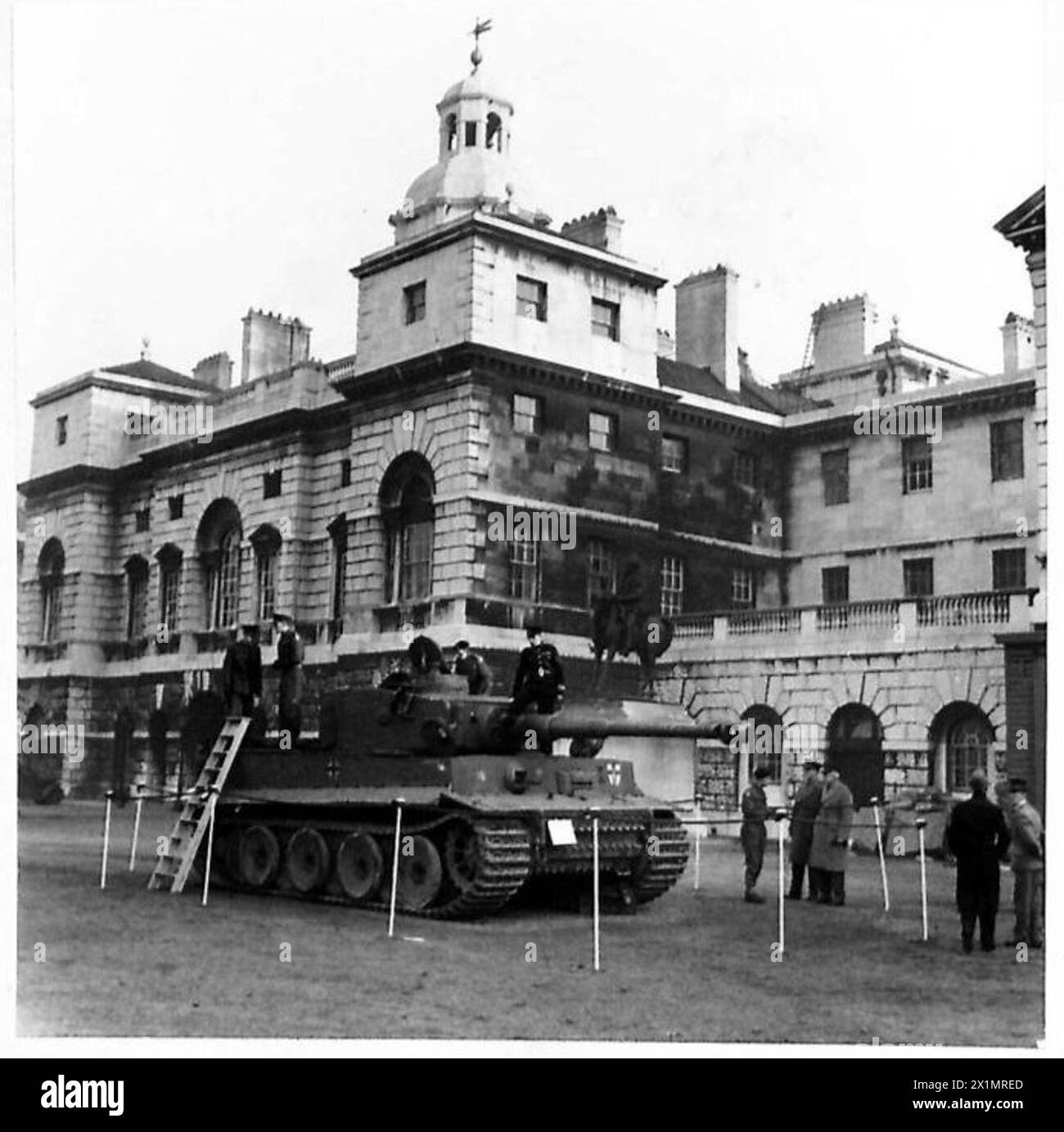 TIGER TANK ON HORSE GUARDS PARADE - Officers and officials inspecting the German Mark VI Tiger tank, British Army Stock Photo