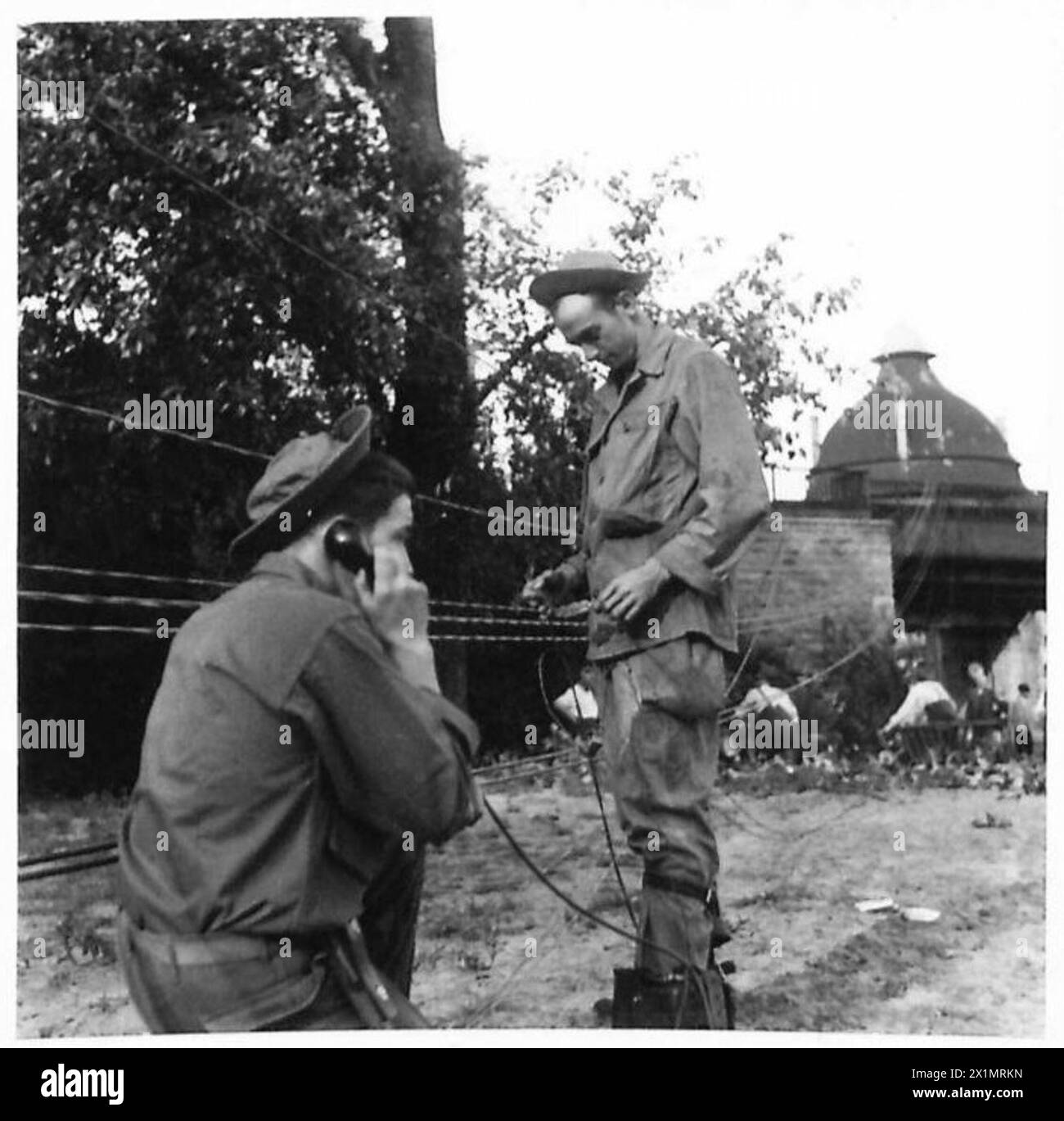 DAMAGE CAUSED BY HURRICANE IN BERLIN - U.S.A. Signals men repairing lines of communication, British Army, 21st Army Group Stock Photo