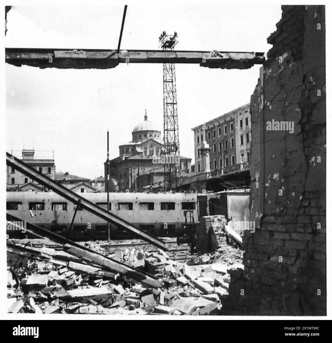 PRECISION BOMBING OF BOLOGNA Through the wreckage of the railway station buildings can be seen