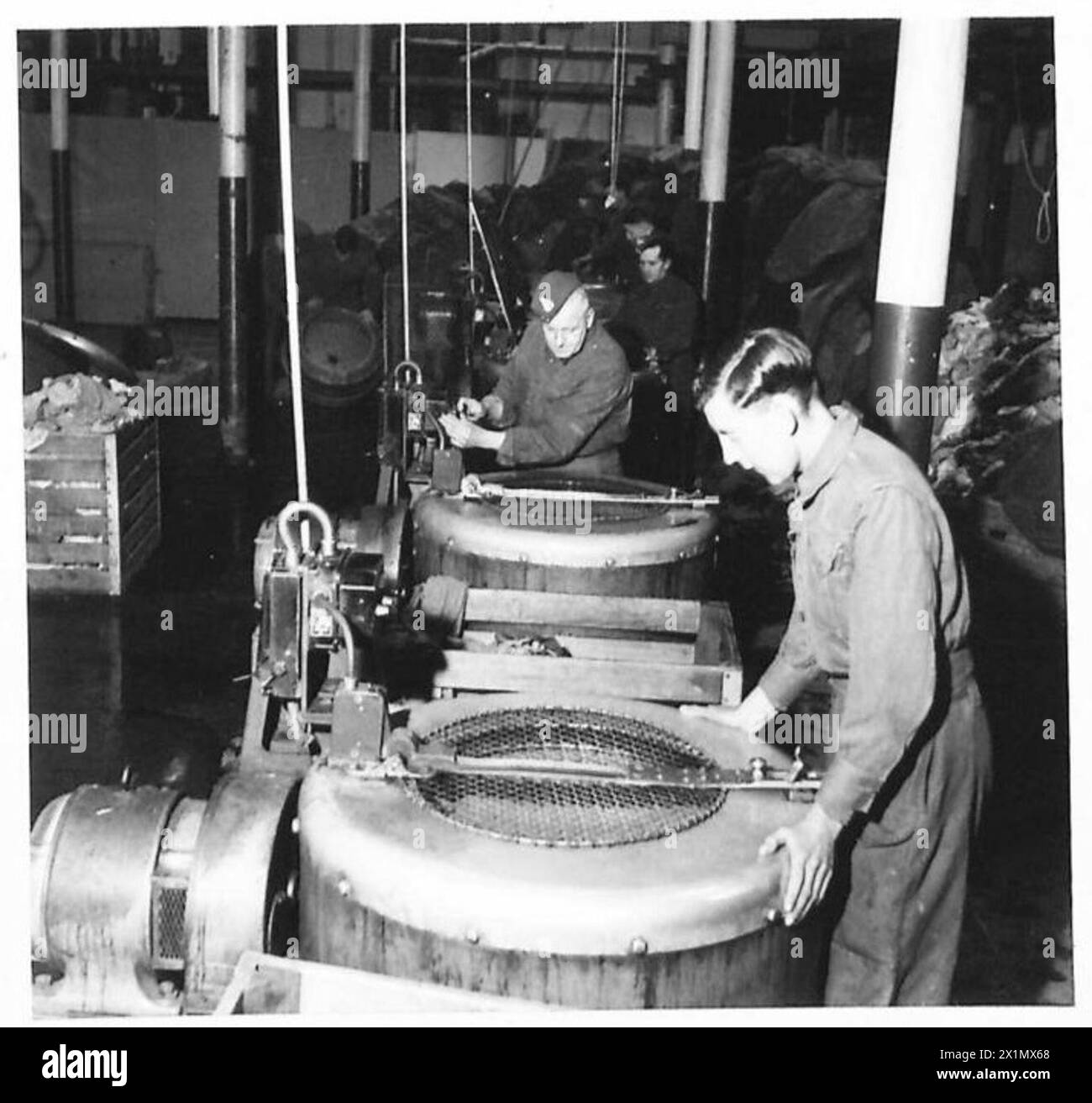 Personnel operate Hydro extractors at static laundry and ...