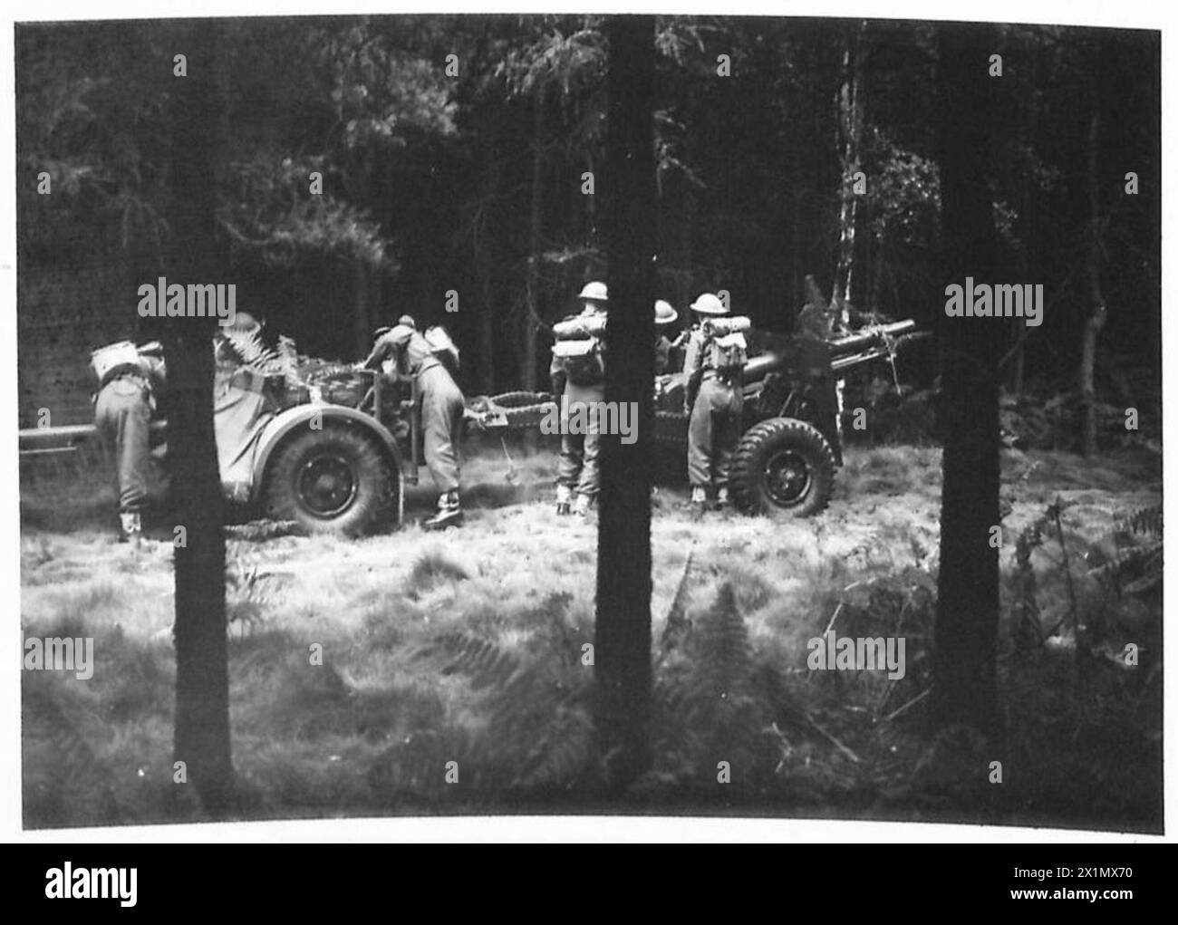 Command Field Gun Royal Artillery personnel prepare a 25-pounder field gun for action in ...