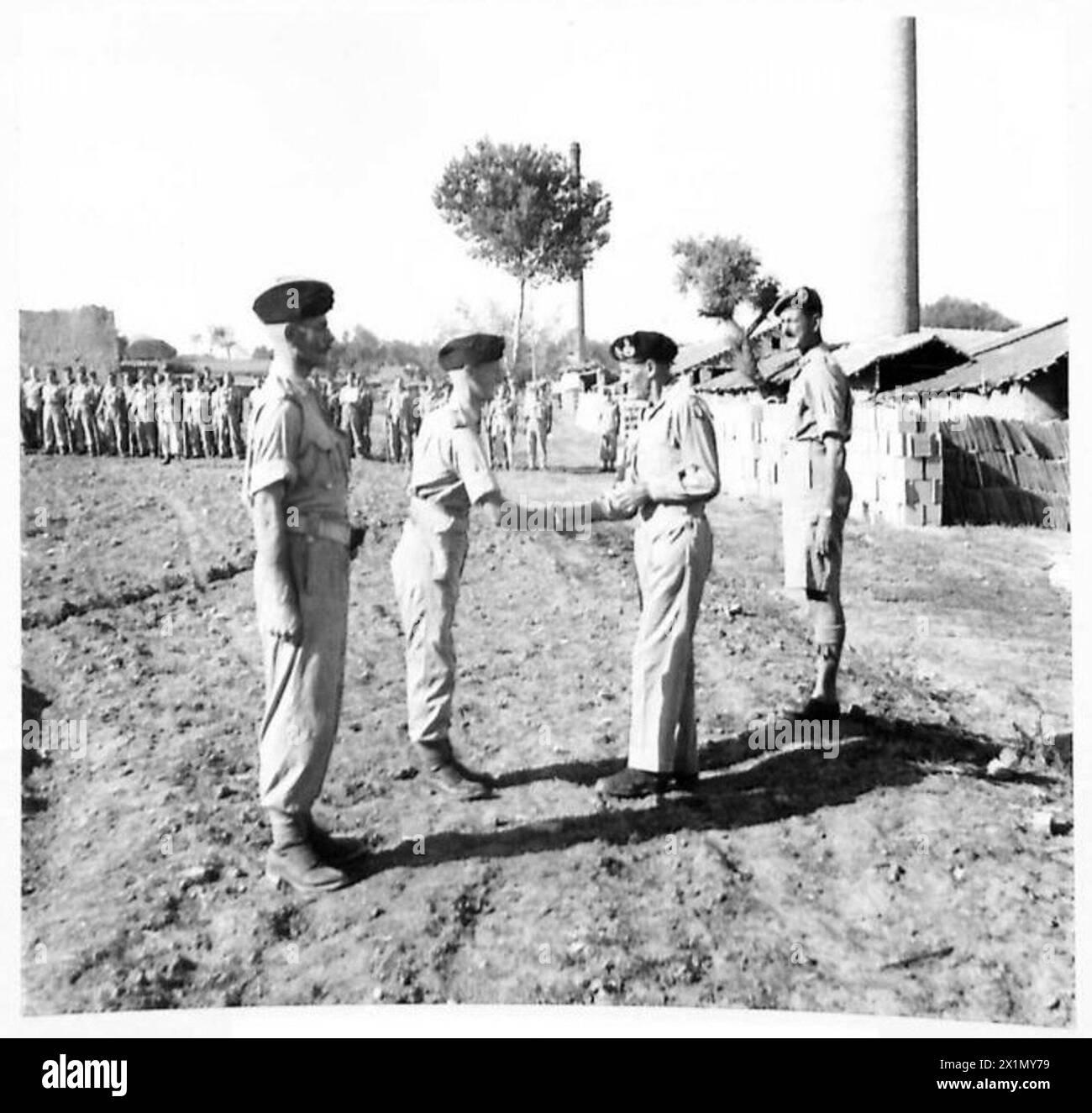 INVESTITURE IN THE FIELD - General Montgomery shaking hands with Capt ...