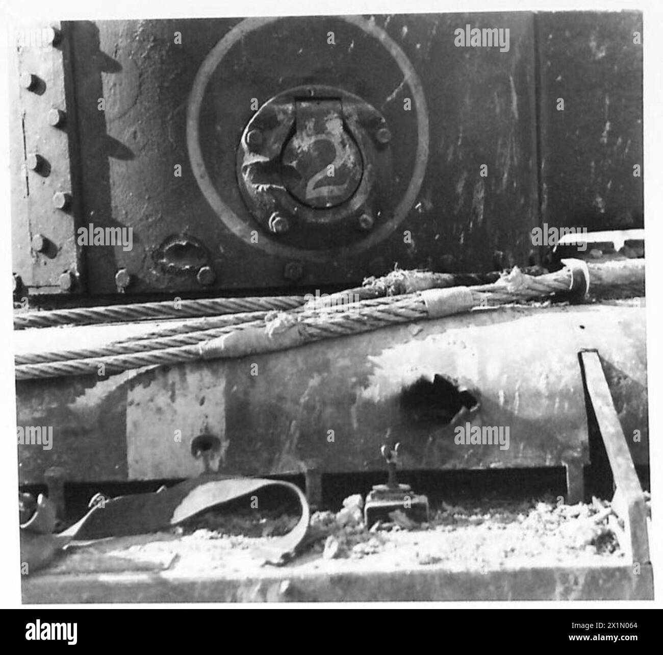 THE BRITISH ARMY IN THE TUNISIA CAMPAIGN, NOVEMBER 1942-MAY 1943 - Battle scars on a a Valentine tank of the 'C' Squadron of one of the 6th Armoured Division's regiments. Two hits of German 50 mm anti-tank shells from the close range distance of 150 yards. The damage seen in the bottom right was caused by a shell which penetrated the tank without serious harm. The Battle of Bou Arada. A forward observation post held by the Germans was known as 'Two Tree' Hill as on its highest point two trees grew. It was important to take the hill as it had advantageous position commanding all the approaches Stock Photo