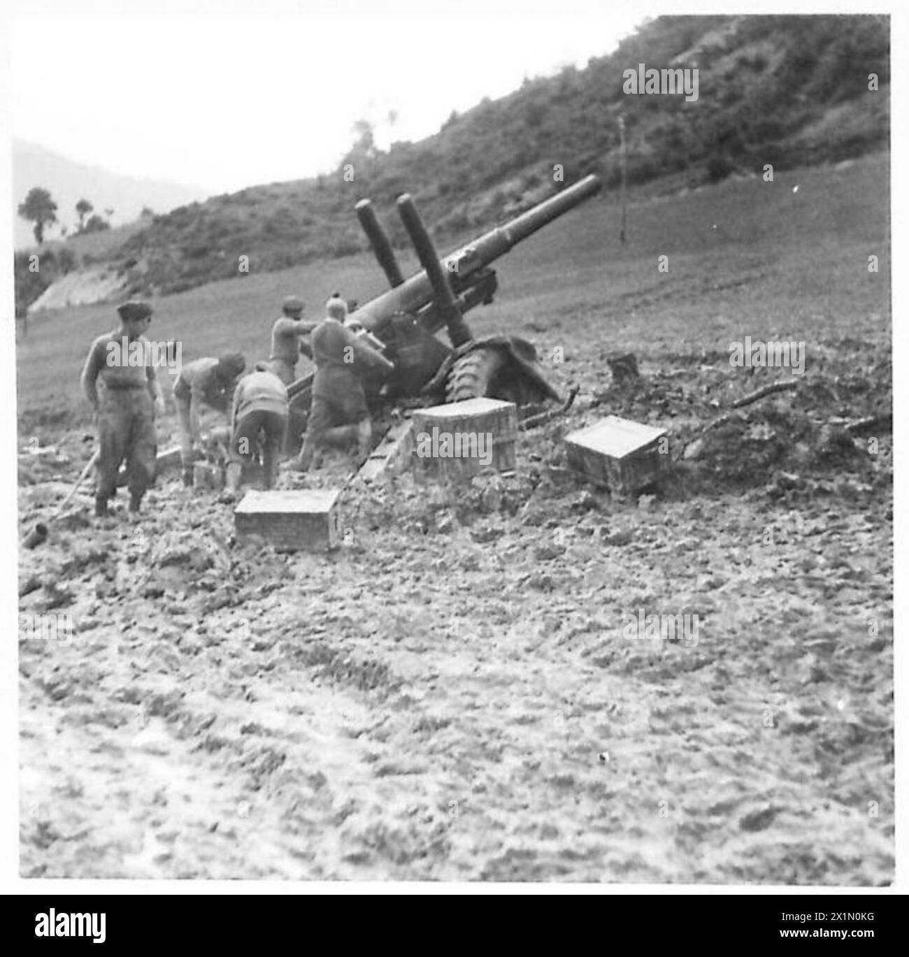 "GENERAL MUD" AGAIN - A 4.5-inch gun firing in the rain from its