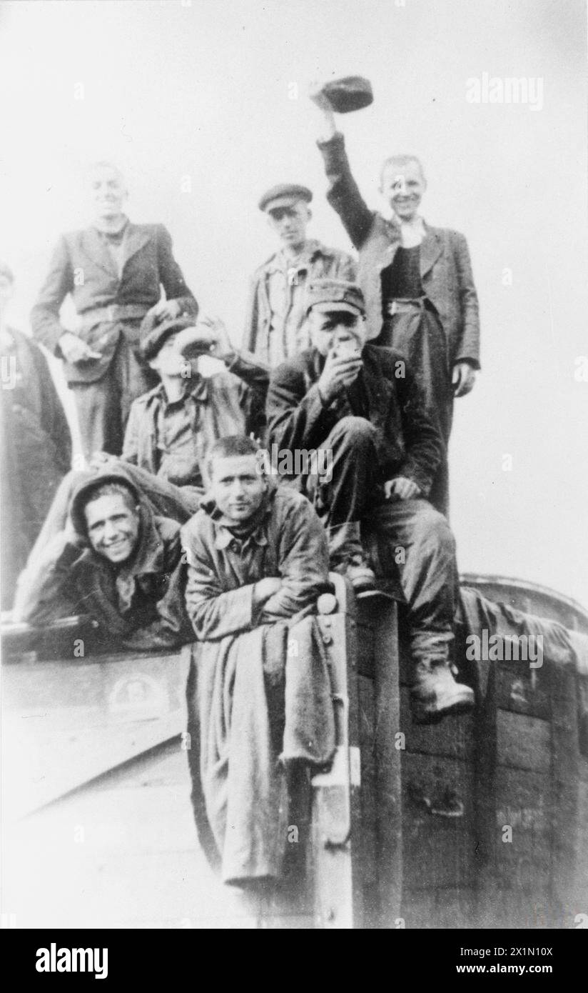 THE HOLOCAUST, 1941-1945 - Liberated Jewish prisoners seen waving from an open top train that had been transporting them from Buchenwald to Theresienstadt (Terezin), 8 May 1945. They were liberated by a unit of Czech partisans after travelling for three weeks without food and water. Many of the prisoners died in transit. Photograph taken by one of the partisans, Stock Photo