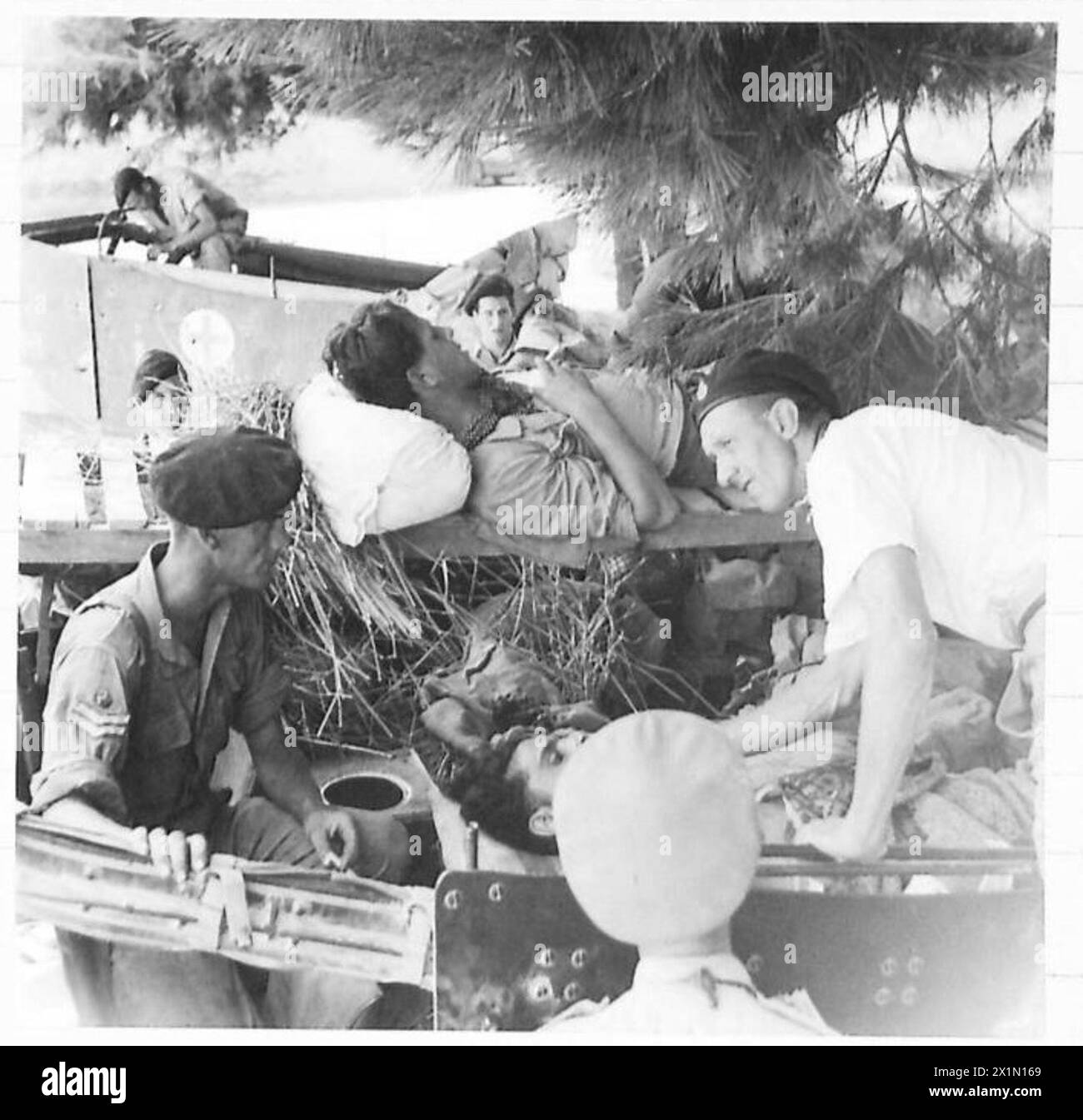 OCCUPATION OF FANO - Two German prisoners receiving treatment from a ...