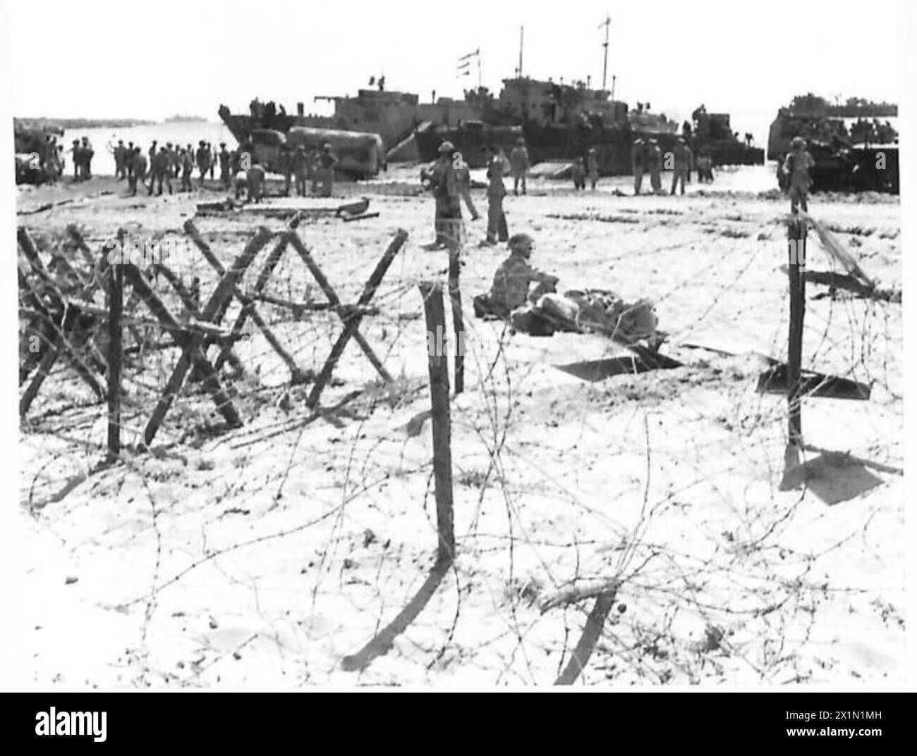 Open Rations British Army Transport vessels deliver British Army troops ashore on a Sicilian ...