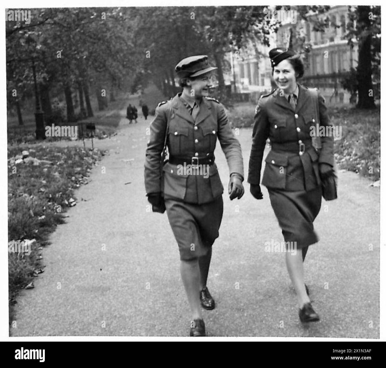 INFANTRY TRANSFER TO ROYAL ARMOURED CORPS - Many Dominion members of the ATS have become officers. Here are Subaltern Thompson, New Zealand (left) and 2nd Subaltern Garigue of Australia. The latter married a British officer. Miss Thompson is wearing the Sam Browne belt which can now be worn by ATS officers, British Army Stock Photo