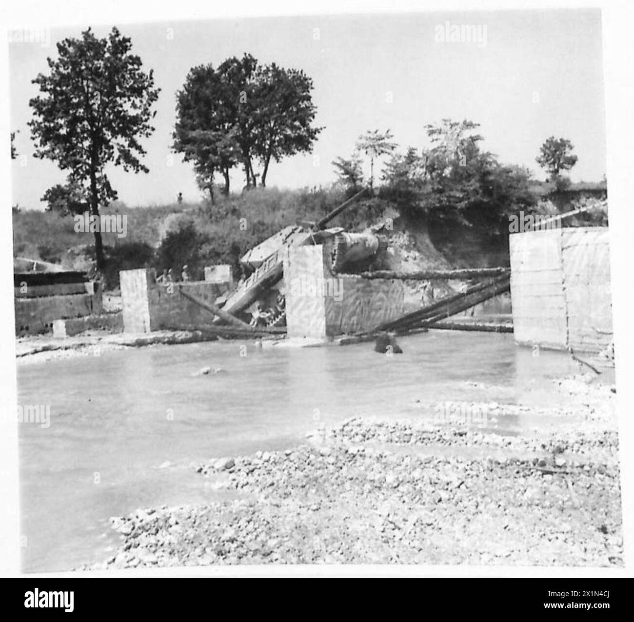 EIGHTH ARMY VARIOUS An M.10 Tank knockedout while crossing the bridge over the River Melfa