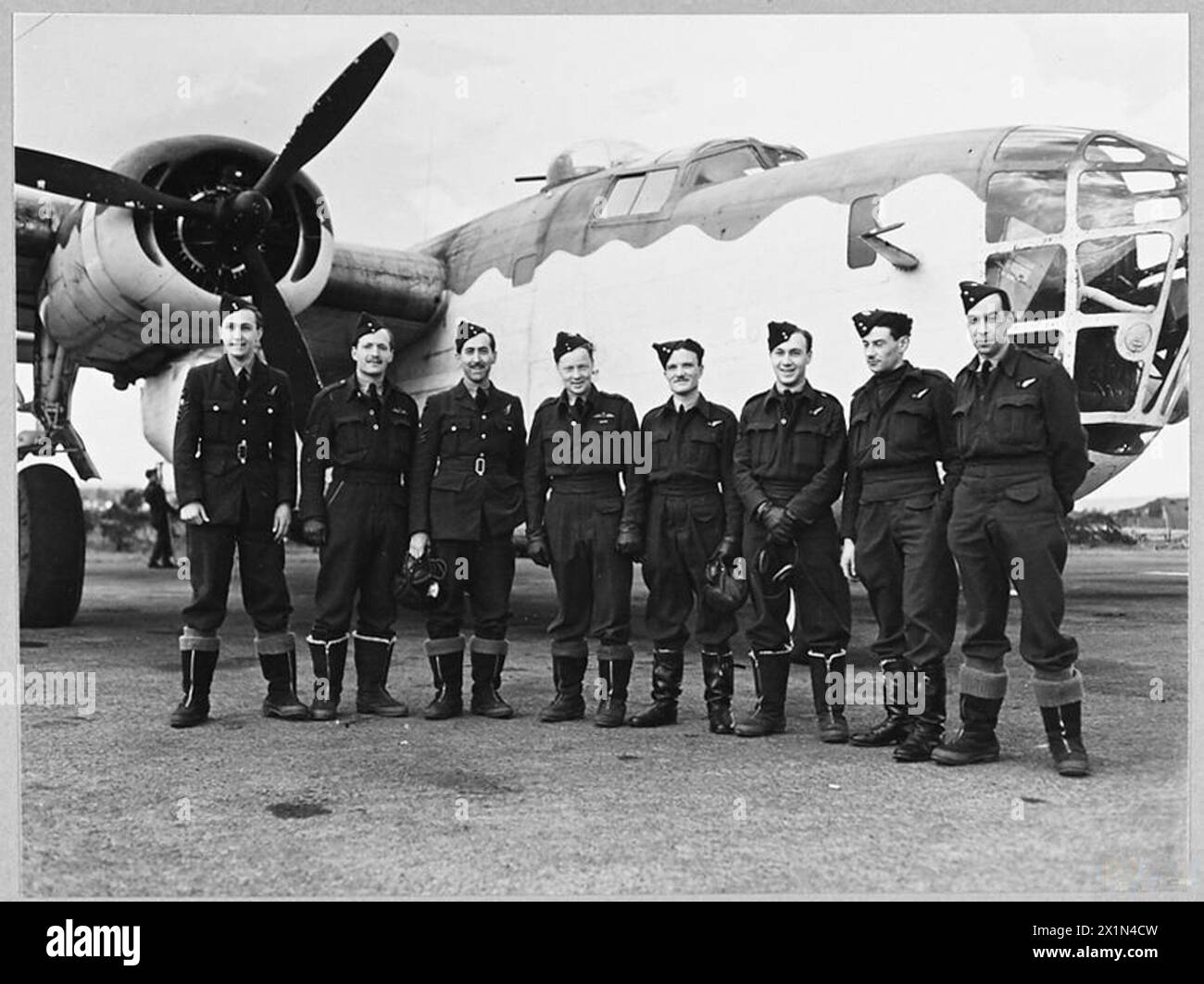 DEFEATING GERMANY'S KEY WEAPON : LIBERATOR v. U-BOAT - 9576 (Picture issued 1943) A Liberator and its crew, Royal Air Force Stock Photo