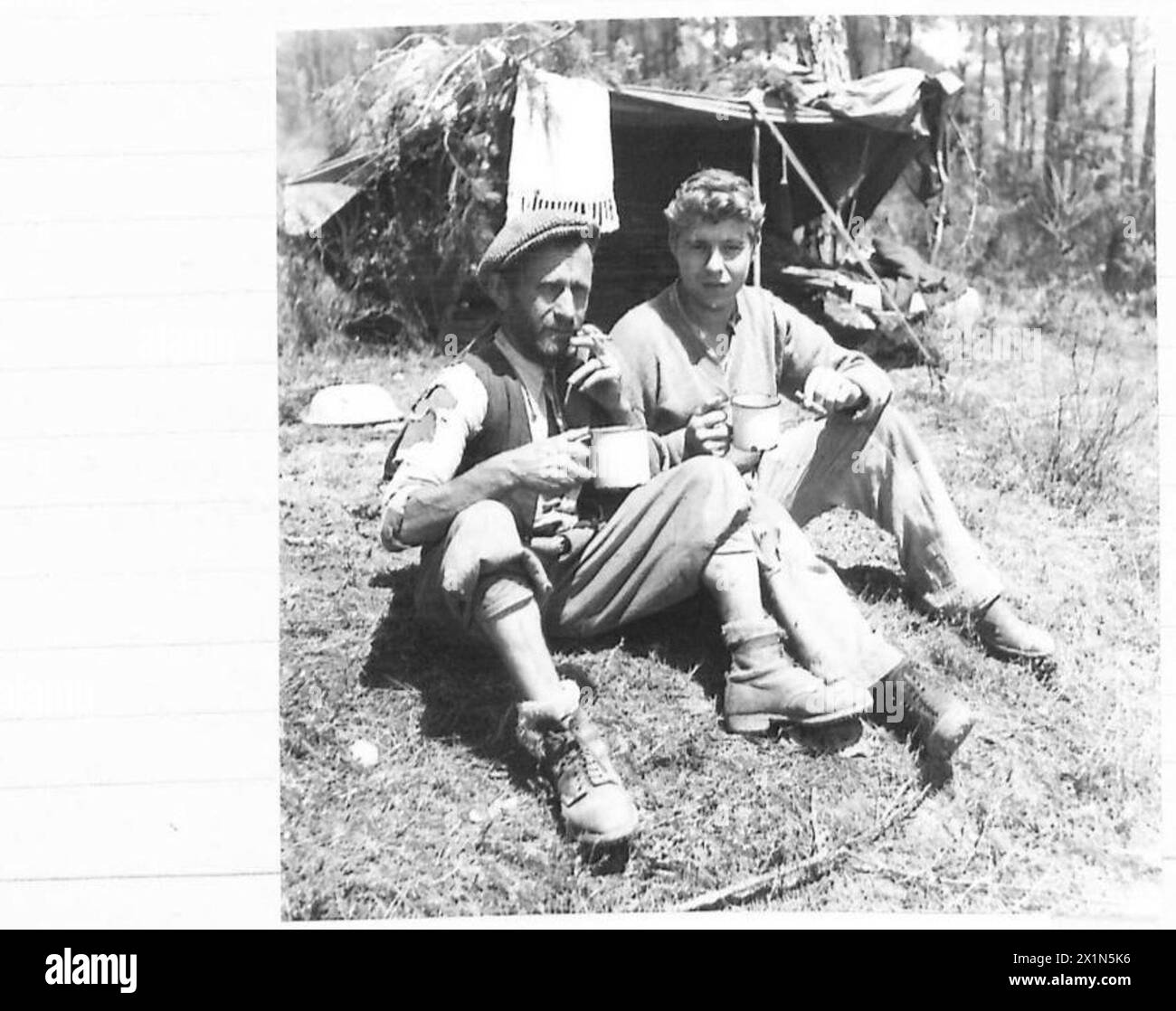 EIGHTH ARMY : ESCAPED ALLIED P.O.W. COME IN - Guiseppe Gineuri of Caprain (left) has been acting as guide to the escaped P.O.Ws and has kept them in food. With him is Ralph Morrison, United States Army, of Clifton Mills, W.Virginia, U.S.A., who was captured at Cassino, British Army Stock Photo