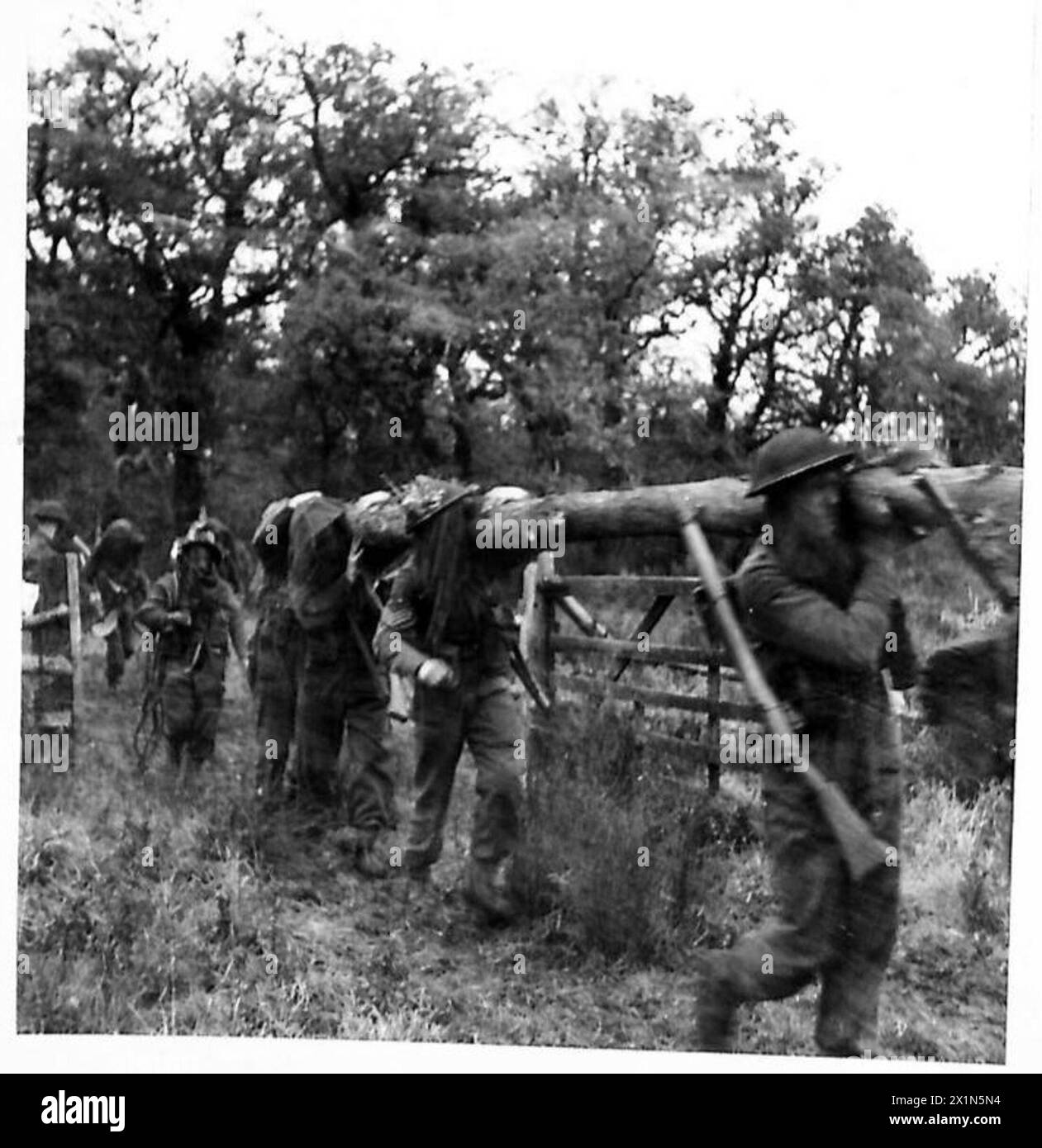 YOUNG SOLDIERS TRAIN UNDER MODERN WARFARE CONDITIONS Troops crawl