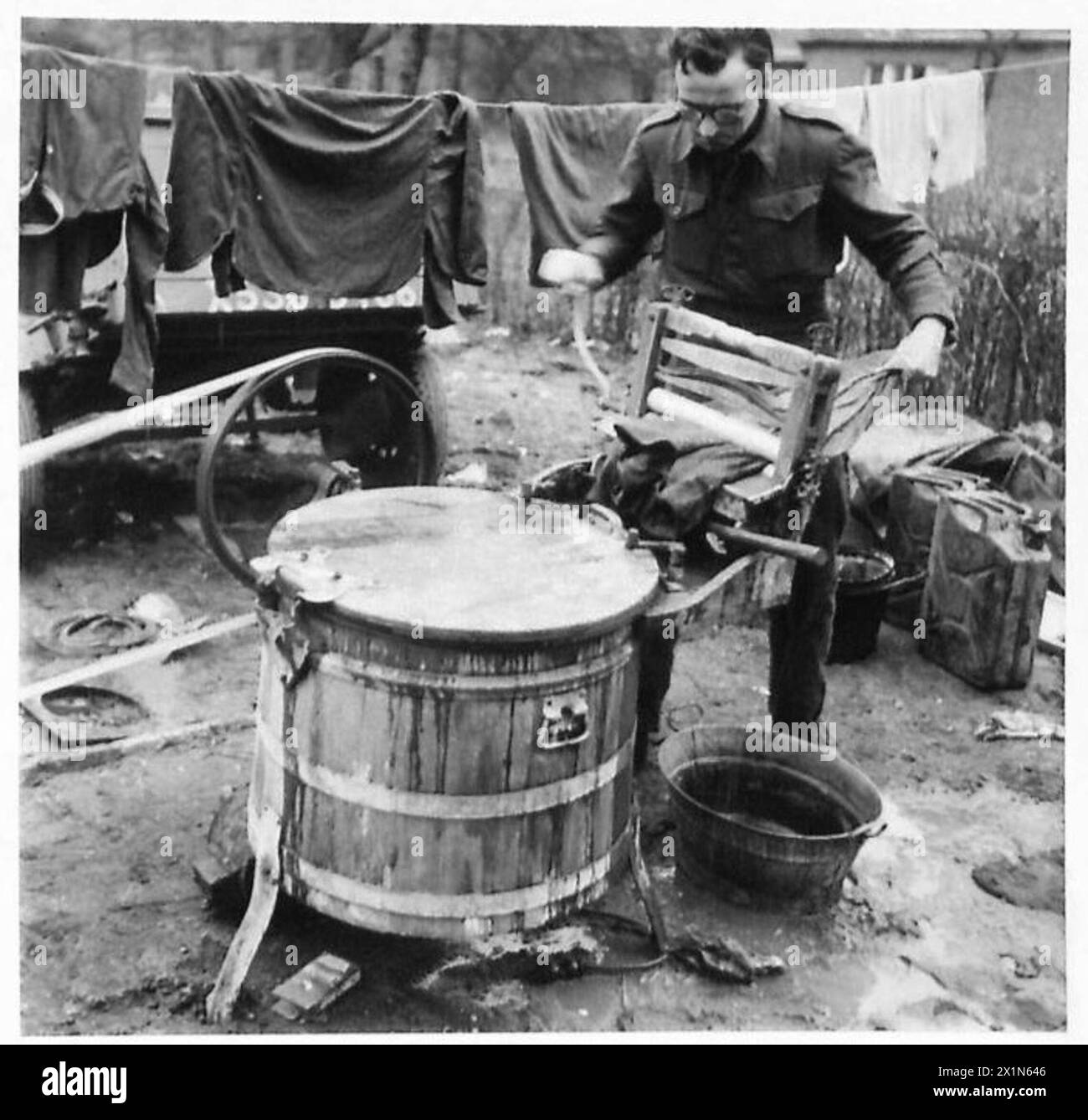 WASH DAY IN THE LINE ON GERMAN SOIL - The washing is finished in quick time and without effort and is not hung out to dry, British Army, 21st Army Group Stock Photo