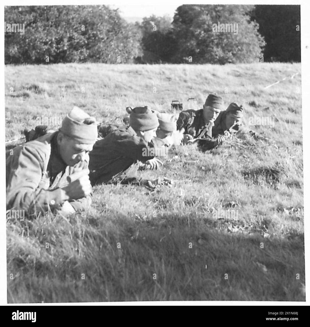 DEMONSTRATION OF BOOBY TRAPS, MINEFIELD RECONNAISSANCE AND CLEARANCE - Assault Clearance : Mines can be detected by means of a long spike or bayonet thrust into the ground. This method is used when a mine detector is not available, British Army Stock Photo