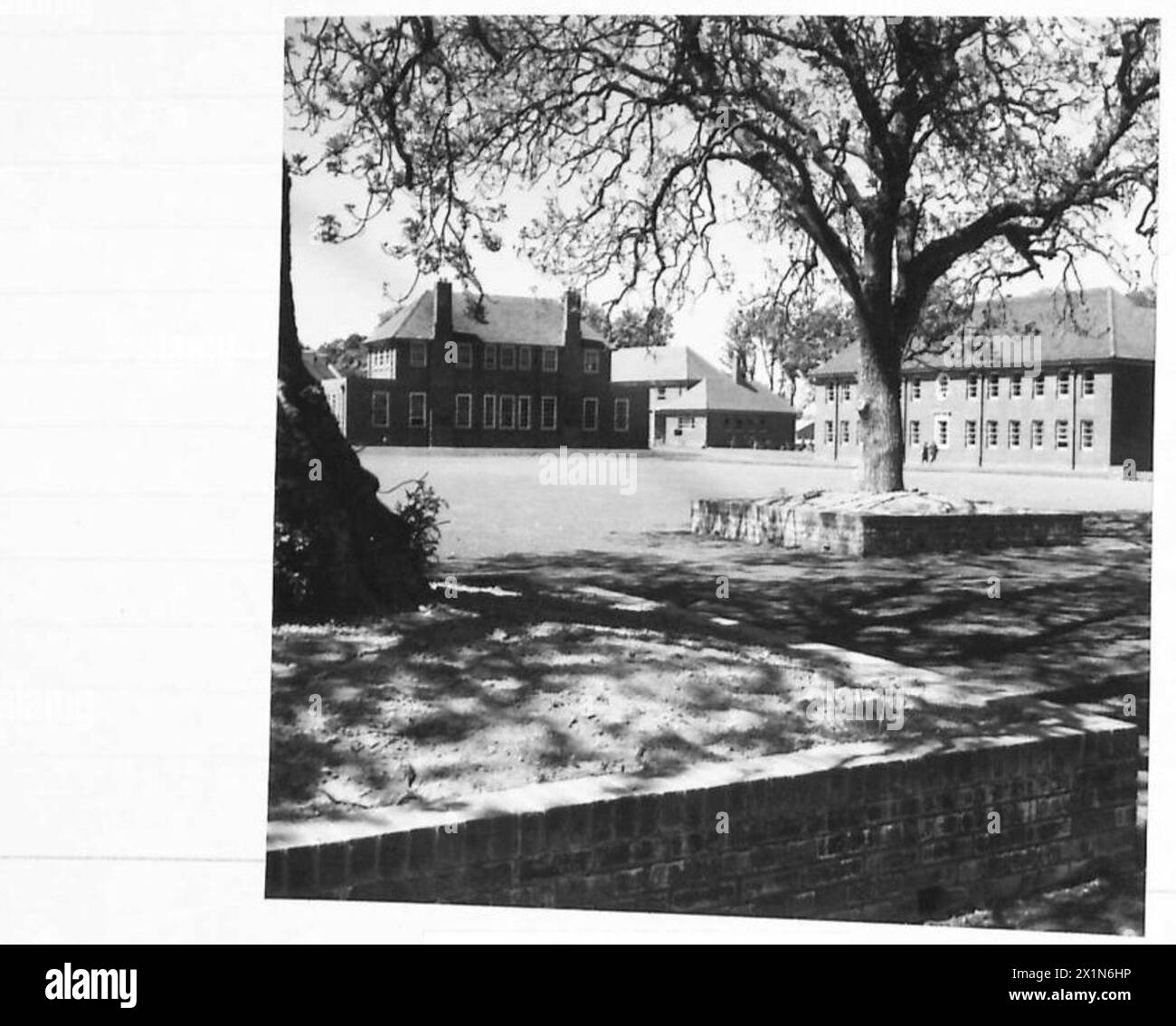 MILITARY BUILDINGS, BALLYMENA, CO.ANTRIM - NAAFI on left and part of Sandhurst Block looking across parade ground, British Army Stock Photo