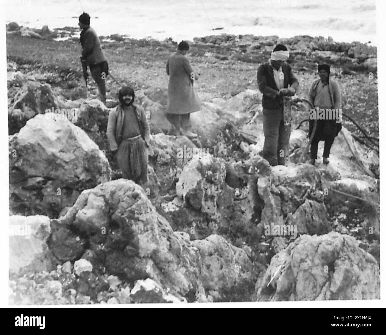 BUILDING THE HAIFA-TRIPOLI RAILWAY - Arabs seen drilling rock along the ...