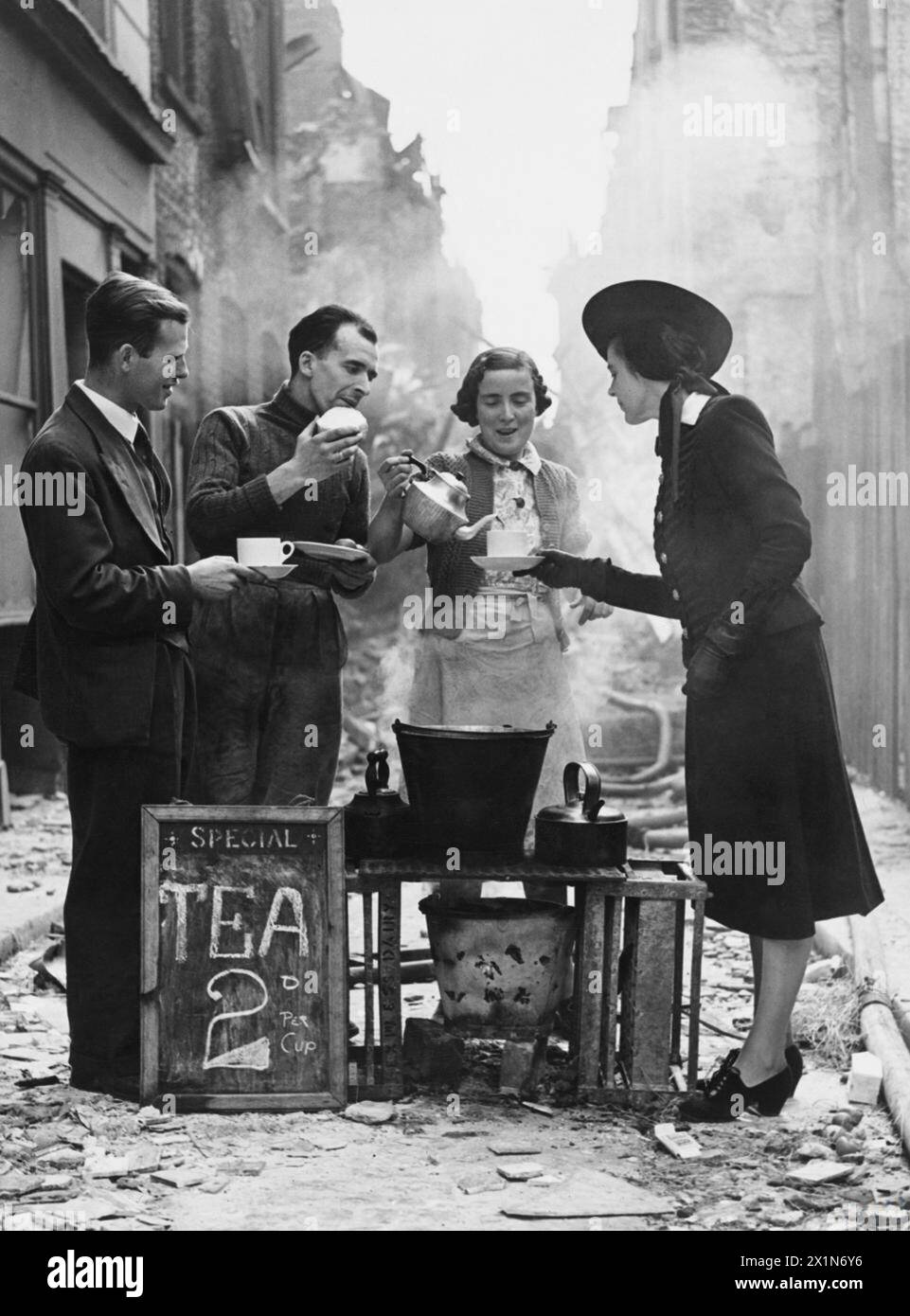 LONDON BLITZ 1940 - 1941 - Morning after a night raid a cafe proprietor in a side street carries on, Stock Photo