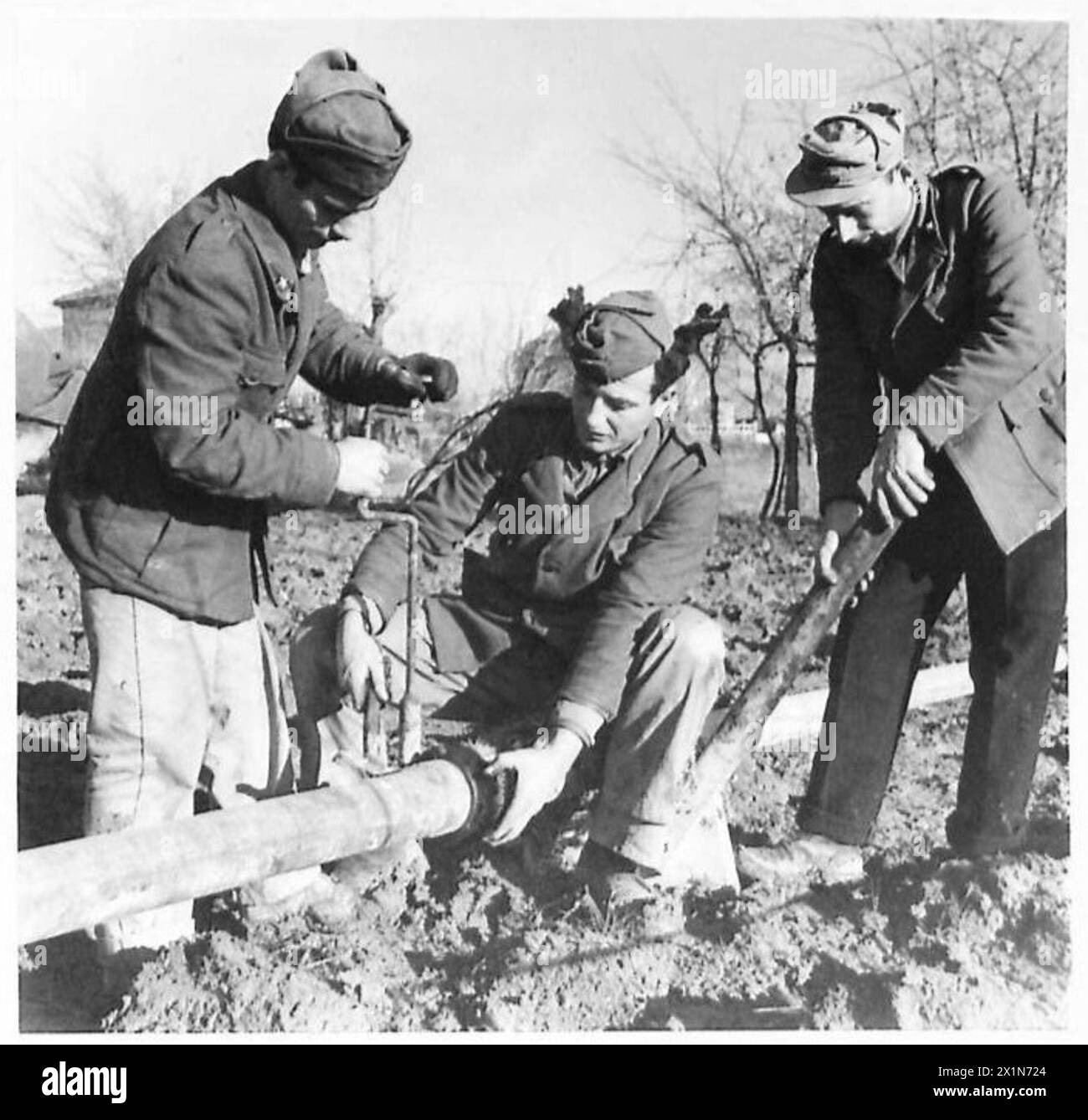 Italian engineers with the Eighth Army assemble a 4-inch pipeline as part of military logistics and infrastructure support, British Army. Stock Photo
