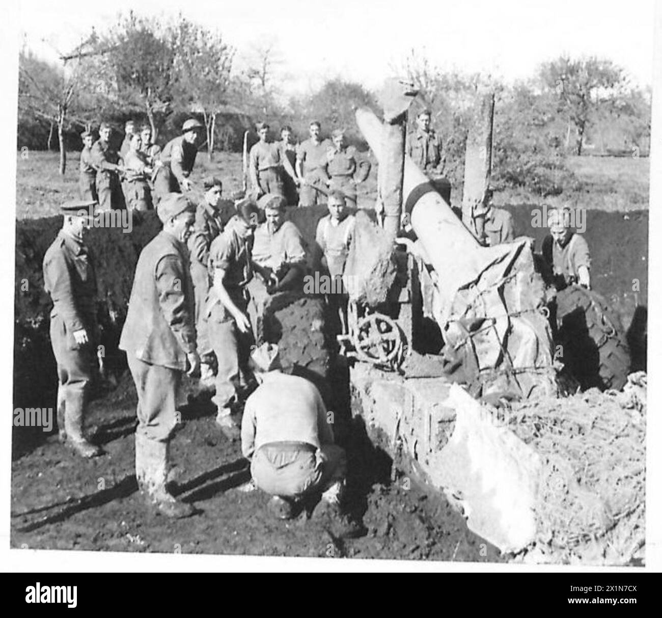 Men of the 99 Medium Battery, 74 Medium Regiment, tow and position a 5. ...
