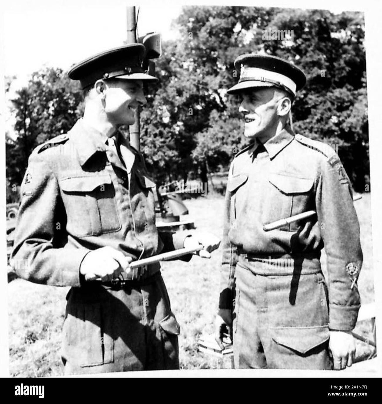 GUN DRILL DEMONSTRATION BY A.A. DETACHMENT - An officer talking to the ...