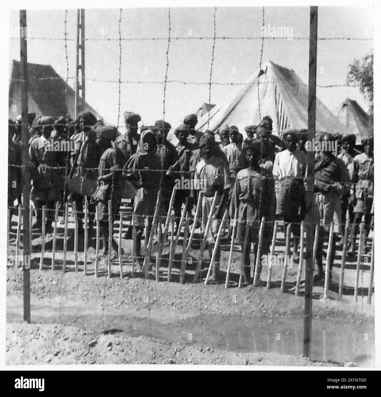 ETHIOPIAN WARRIORS AID BRITISH TROOPS - Fascist native auxiliaries captured by British patrols during our regular forays into Abyssinia. Altogether 300 of them, including Eritrean, Gallas and Abyssinian conscripts have been rounded up during our recent actions inside enemy territory. The prisoners shown in the pictures were captured on the Aroma and Kassala fronts, British Army Stock Photo
