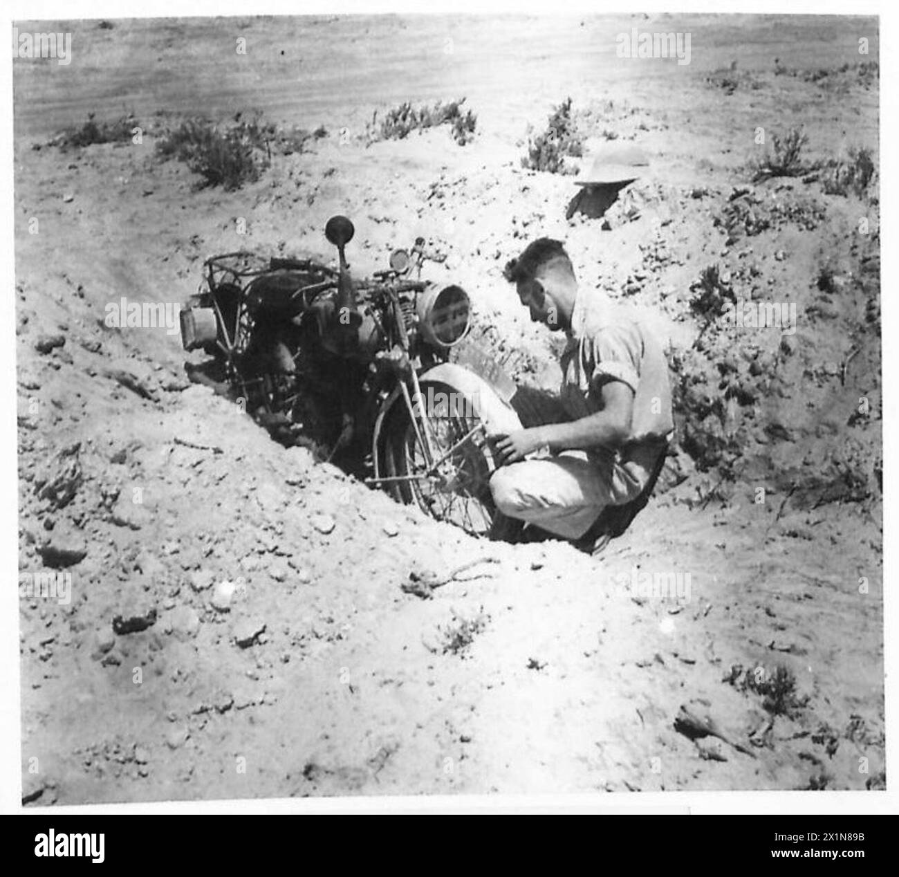 OFFICIAL PHOTOGRAPHS TAKEN IN THE WESTERN DESERT - A despatch rider in ...