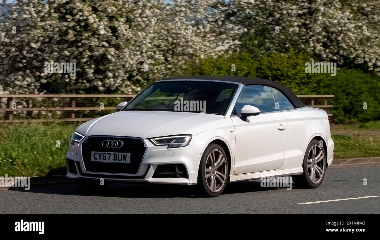 Milton Keynes,UK- Apr 14th 2024: 2017 white Audi A3 car  travelling   on a British road Stock Photo