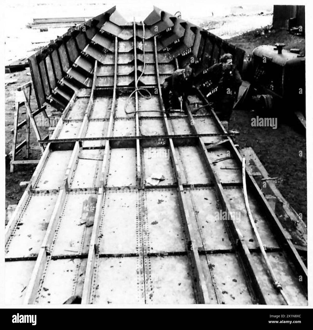 Open Rations British Army Royal Engineers assemble a new single screw motor launch alongside a ...