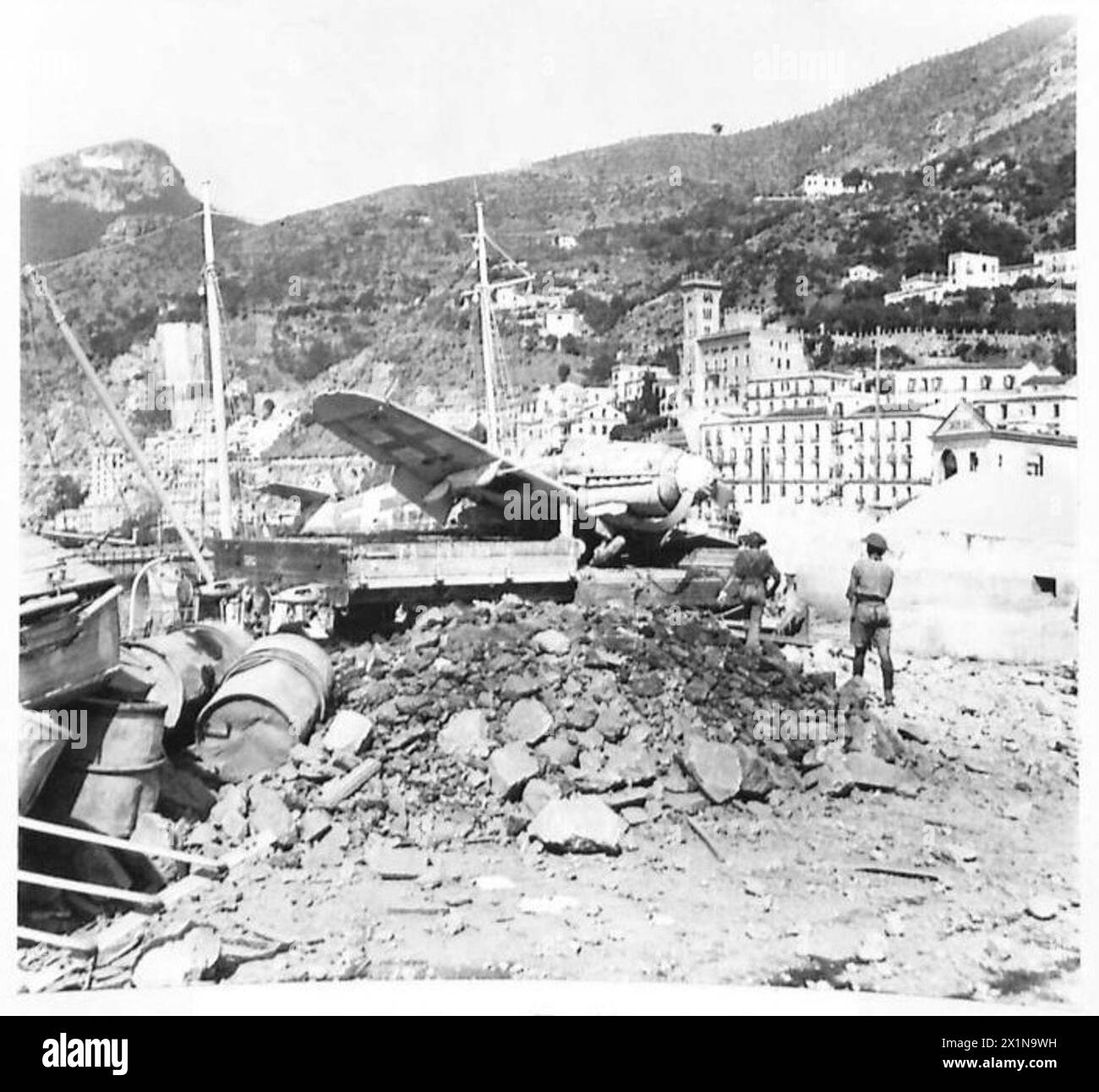 A German ME 109 aircraft destroyed in the docks at Salerno during ...